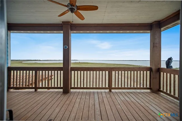 a view of a balcony with wooden floor