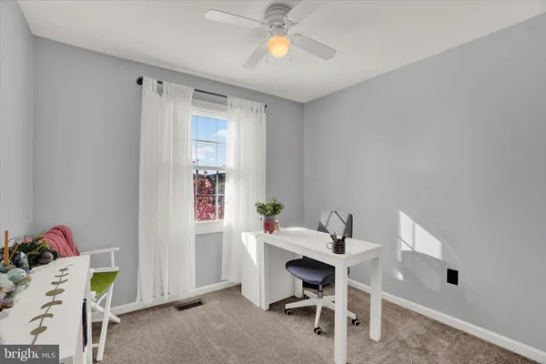 a workspace with furniture and window