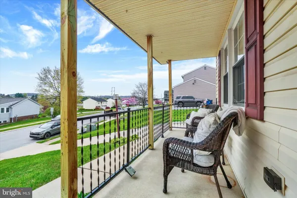 a view of a chair and tables in the backyard