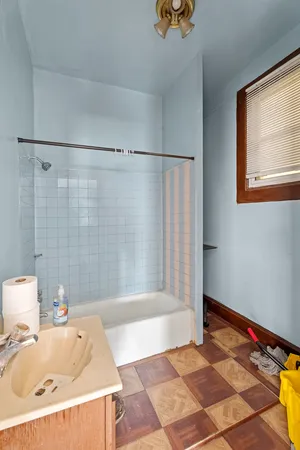 a living room with a couch and a dining table