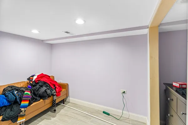 a bedroom with furniture and a swimming pool