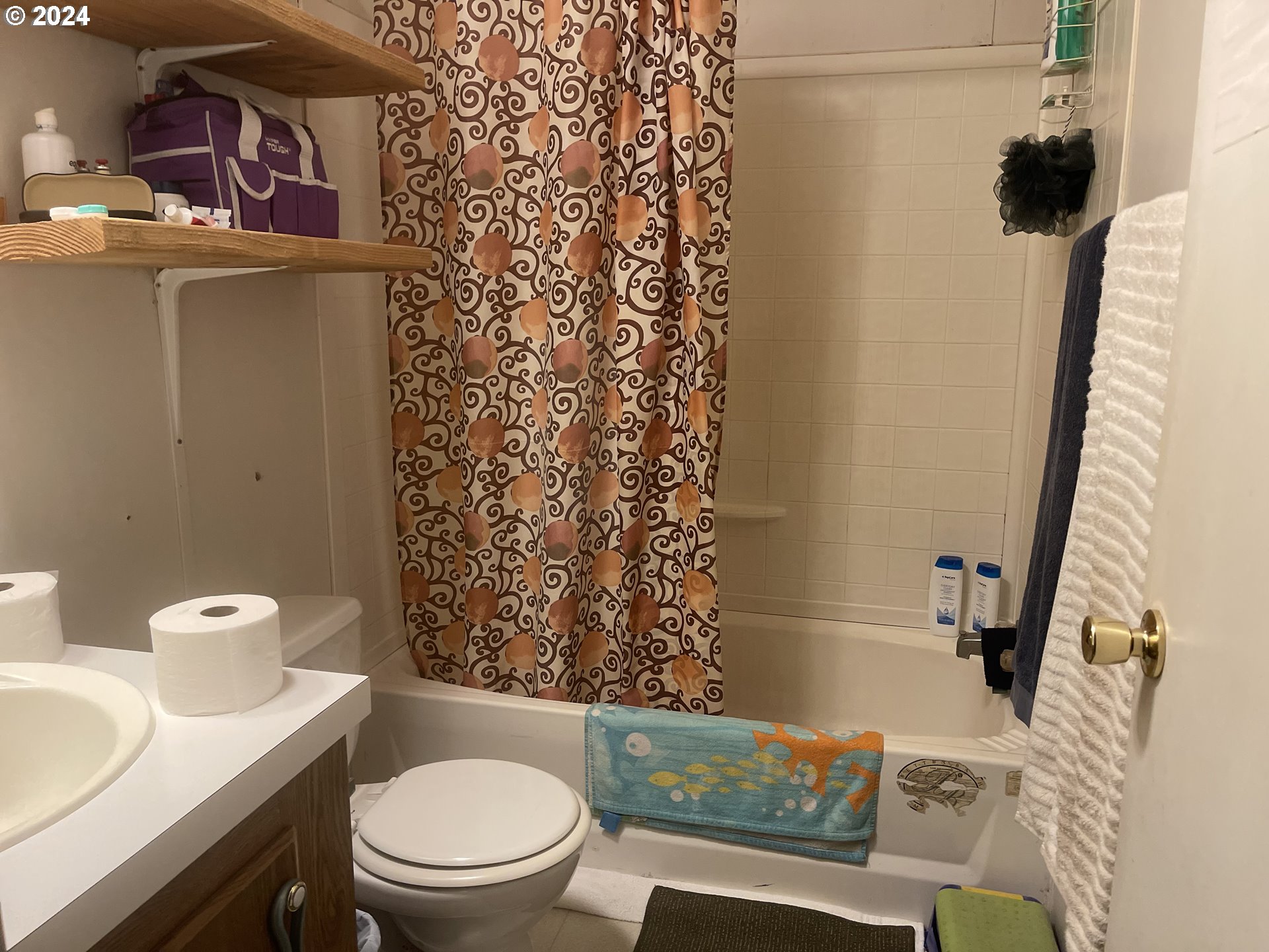8295 King Road Grand Ronde, OR 97347 - Photo 28 of 32 a white toilet sitting next to a bathroom sink