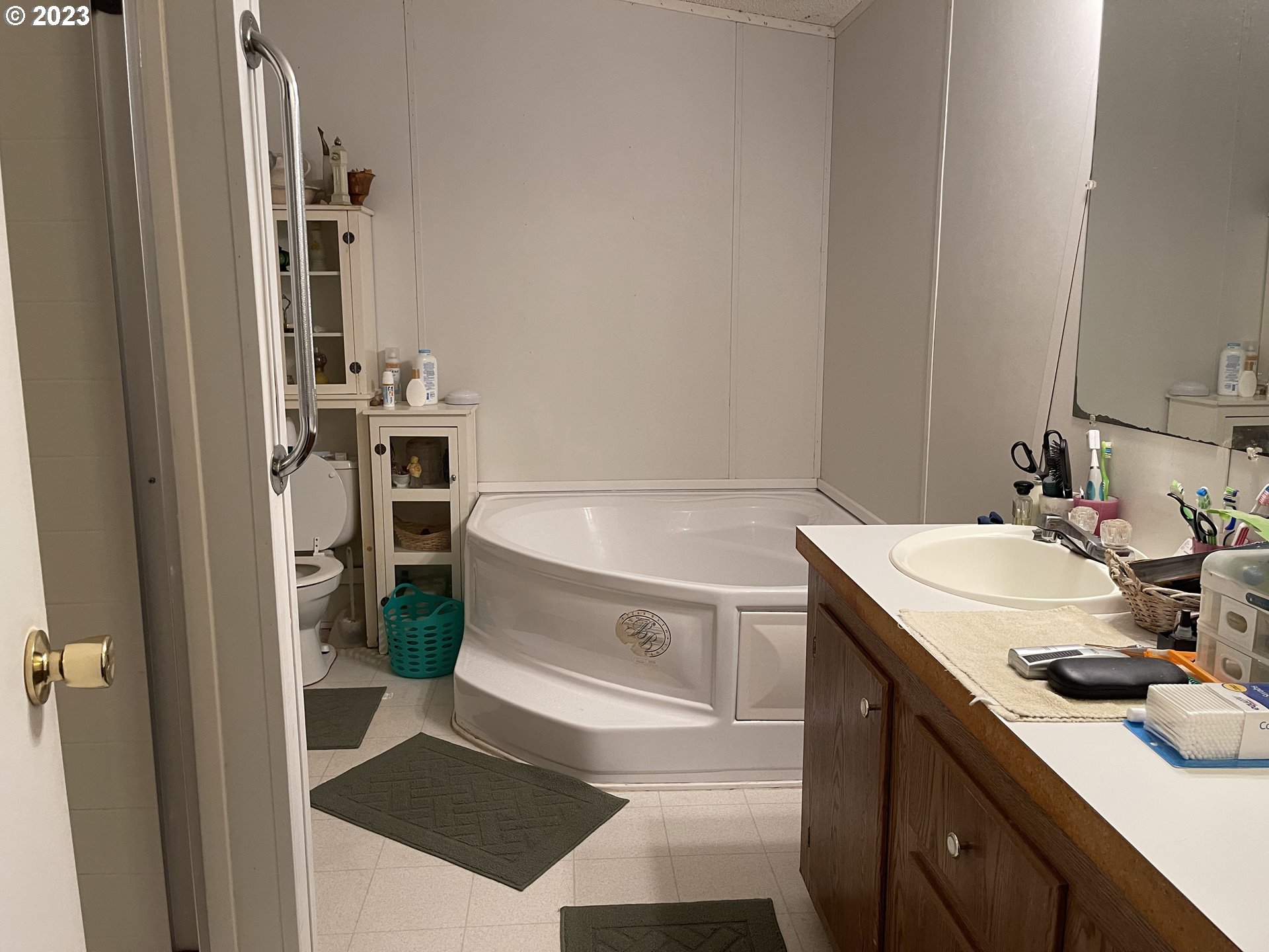 8295 King Road Grand Ronde, OR 97347 - Photo 8 of 32 a bathroom with a sink and a mirror