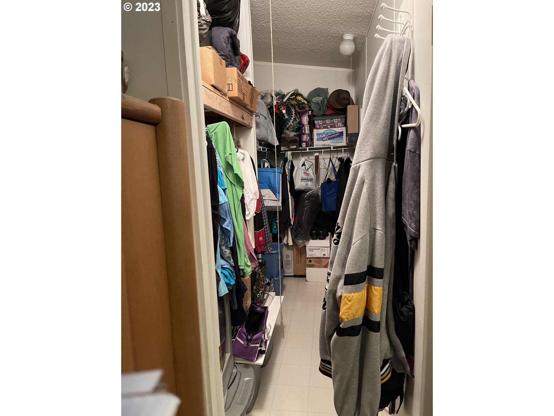 8295 King Road Grand Ronde, OR 97347 - Photo 10 of 32 a view of walk in closet with clothes and shoes