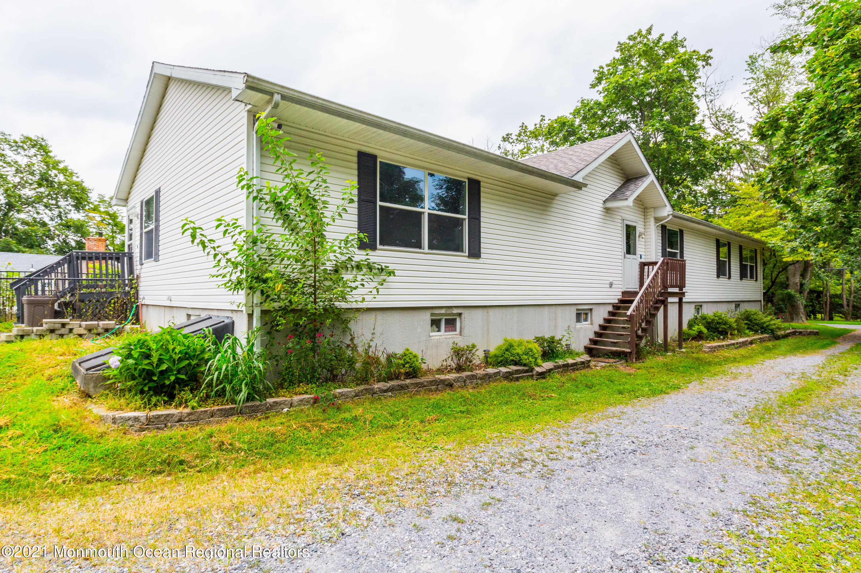 544 Brickyard Road Freehold, NJ 07728 - Photo 2 of 24 a front view of house with yard and green space