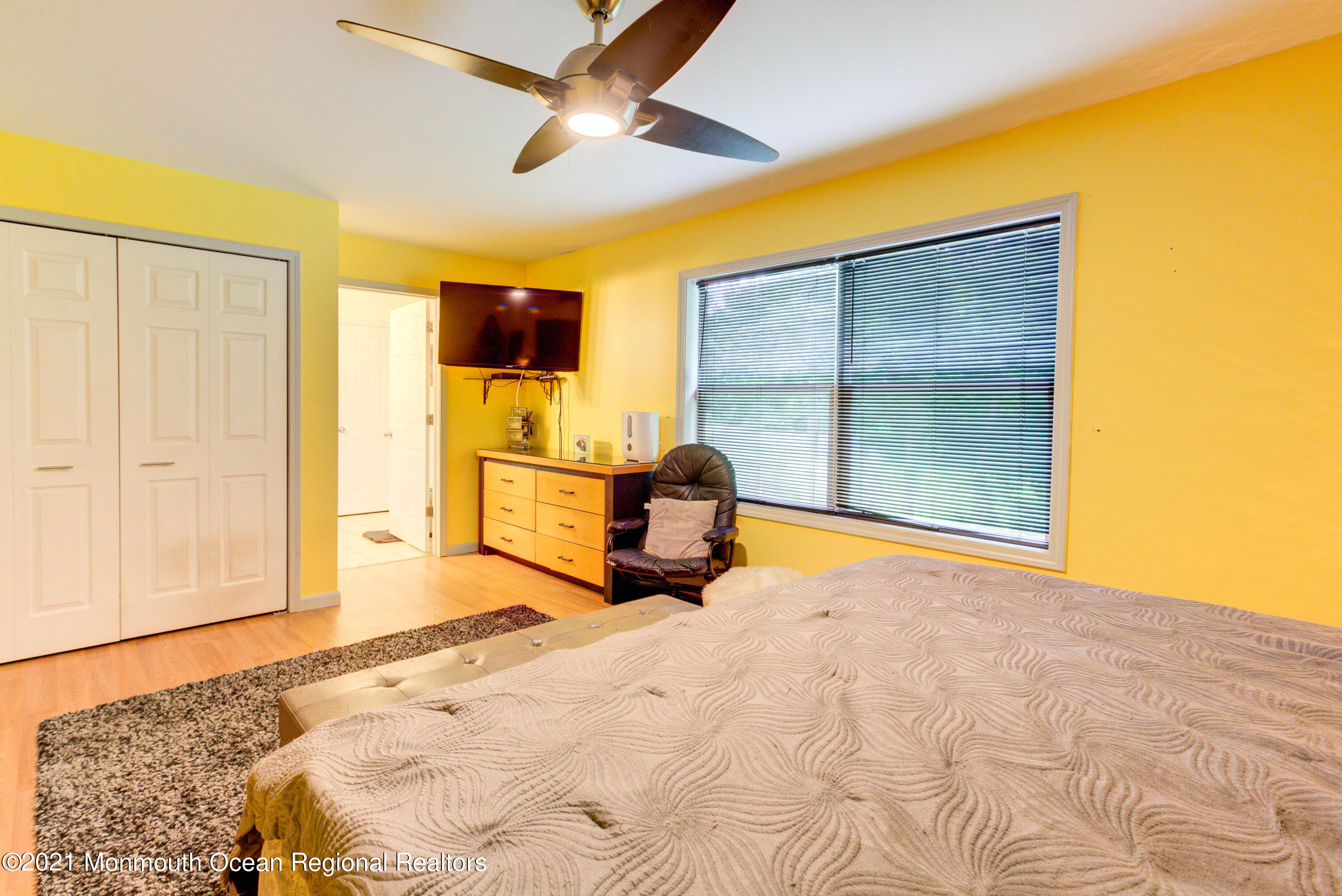 544 Brickyard Road Freehold, NJ 07728 - Photo 12 of 24 a bed room with a bed and a flat screen tv