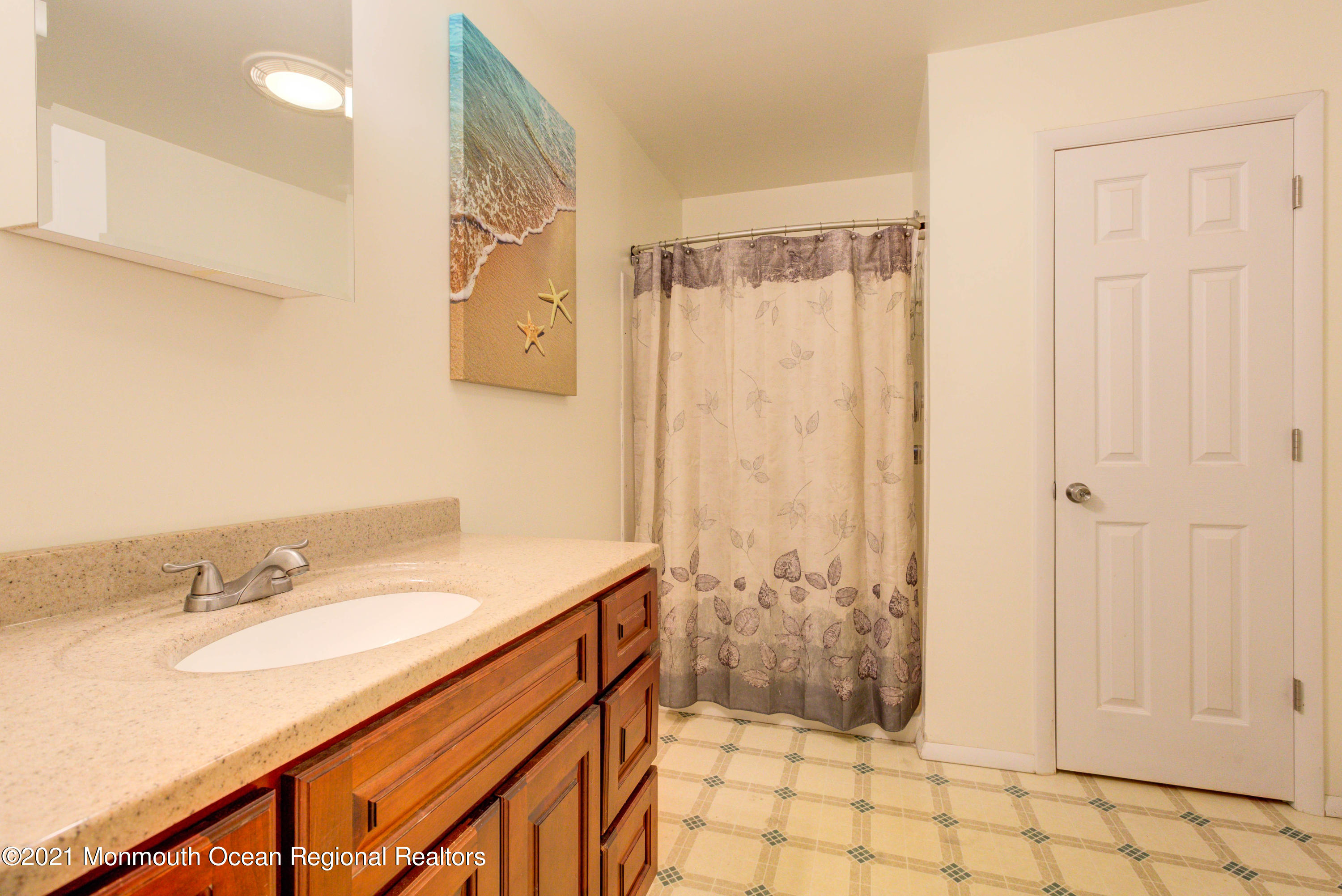 544 Brickyard Road Freehold, NJ 07728 - Photo 13 of 24 a bathroom with a sink and a mirror