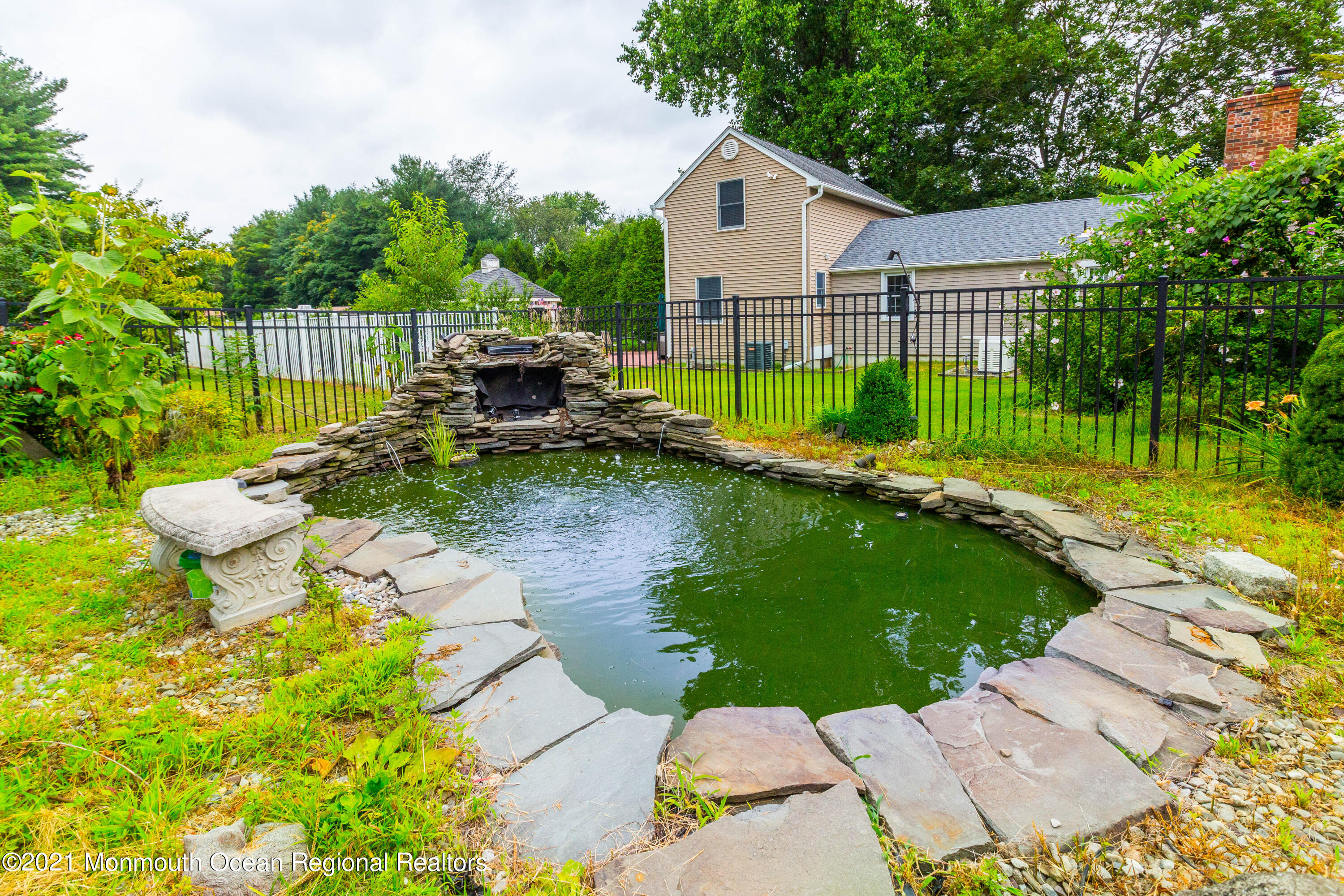 544 Brickyard Road Freehold, NJ 07728 - Photo 20 of 24 a front view of a house with garden