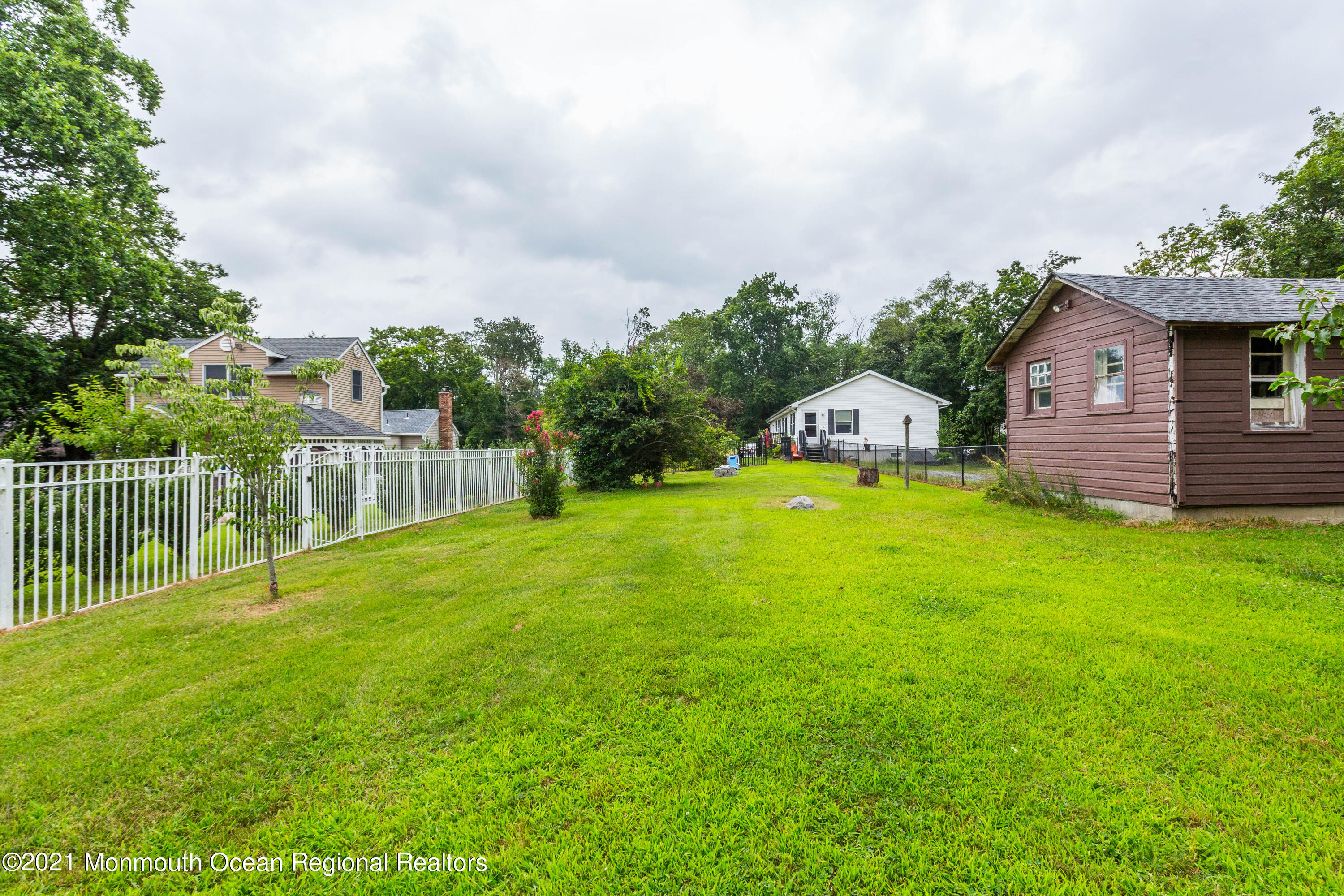 544 Brickyard Road Freehold, NJ 07728 - Photo 21 of 24 a view of a house with a backyard