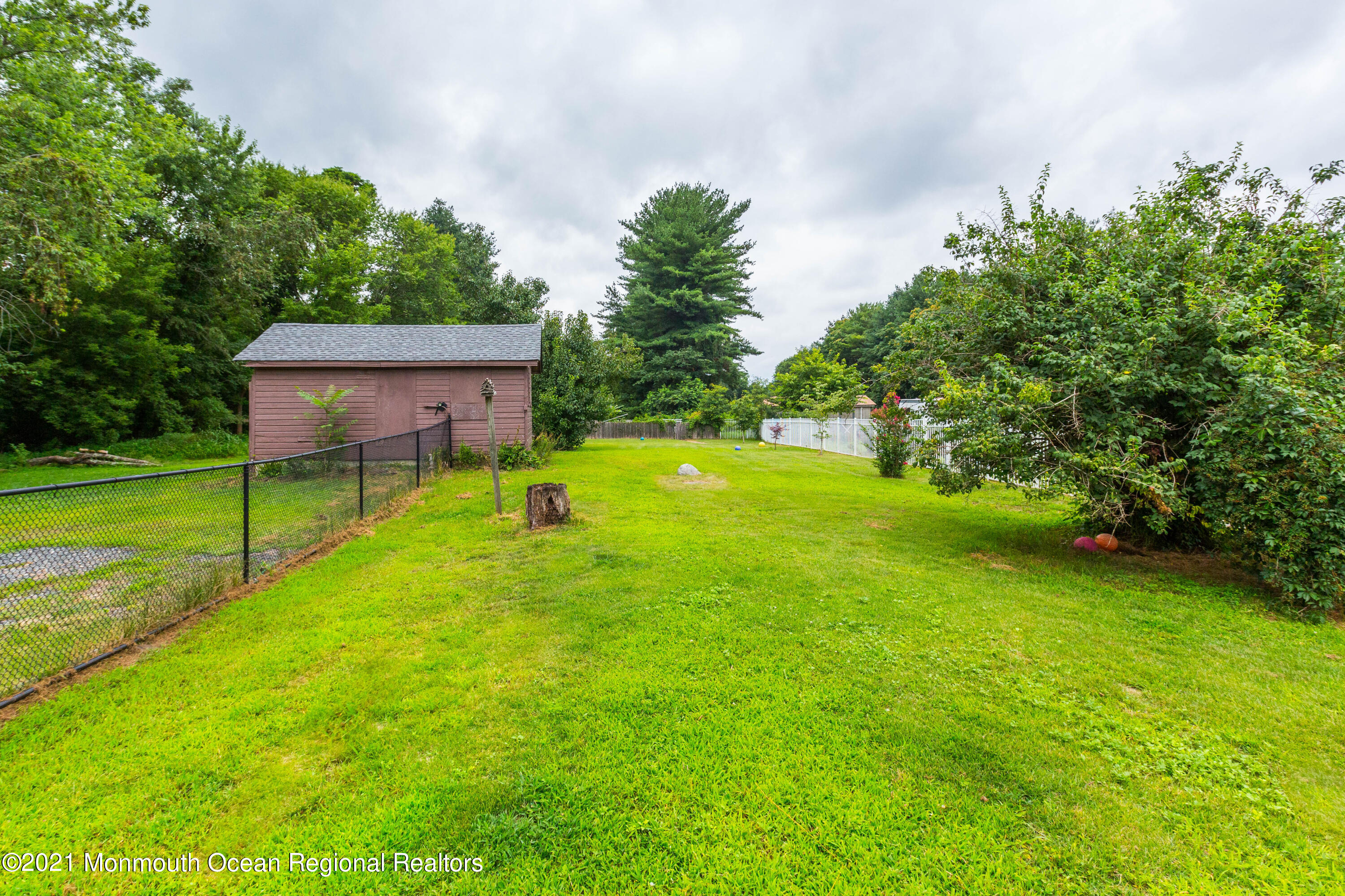 544 Brickyard Road Freehold, NJ 07728 - Photo 22 of 24 a view of a backyard with a garden