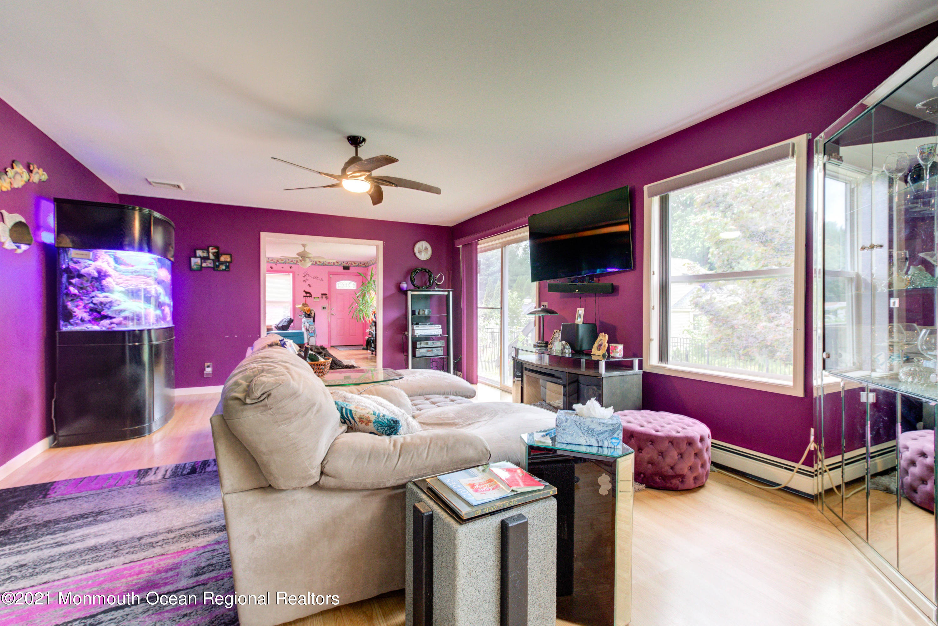 544 Brickyard Road Freehold, NJ 07728 - Photo 4 of 24 a living room with furniture and a flat screen tv