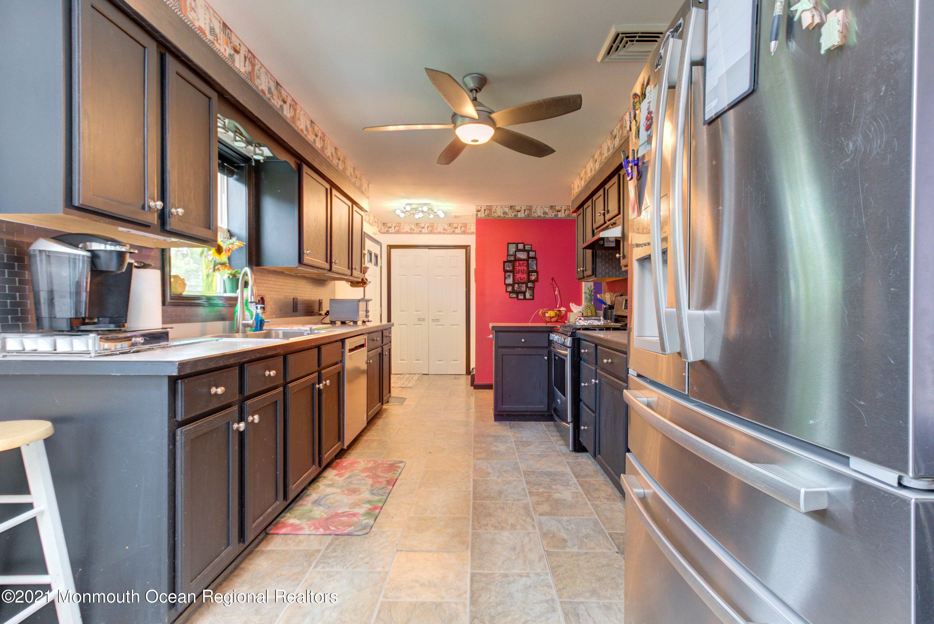 544 Brickyard Road Freehold, NJ 07728 - Photo 7 of 24 a kitchen with stainless steel appliances granite countertop a sink and cabinets