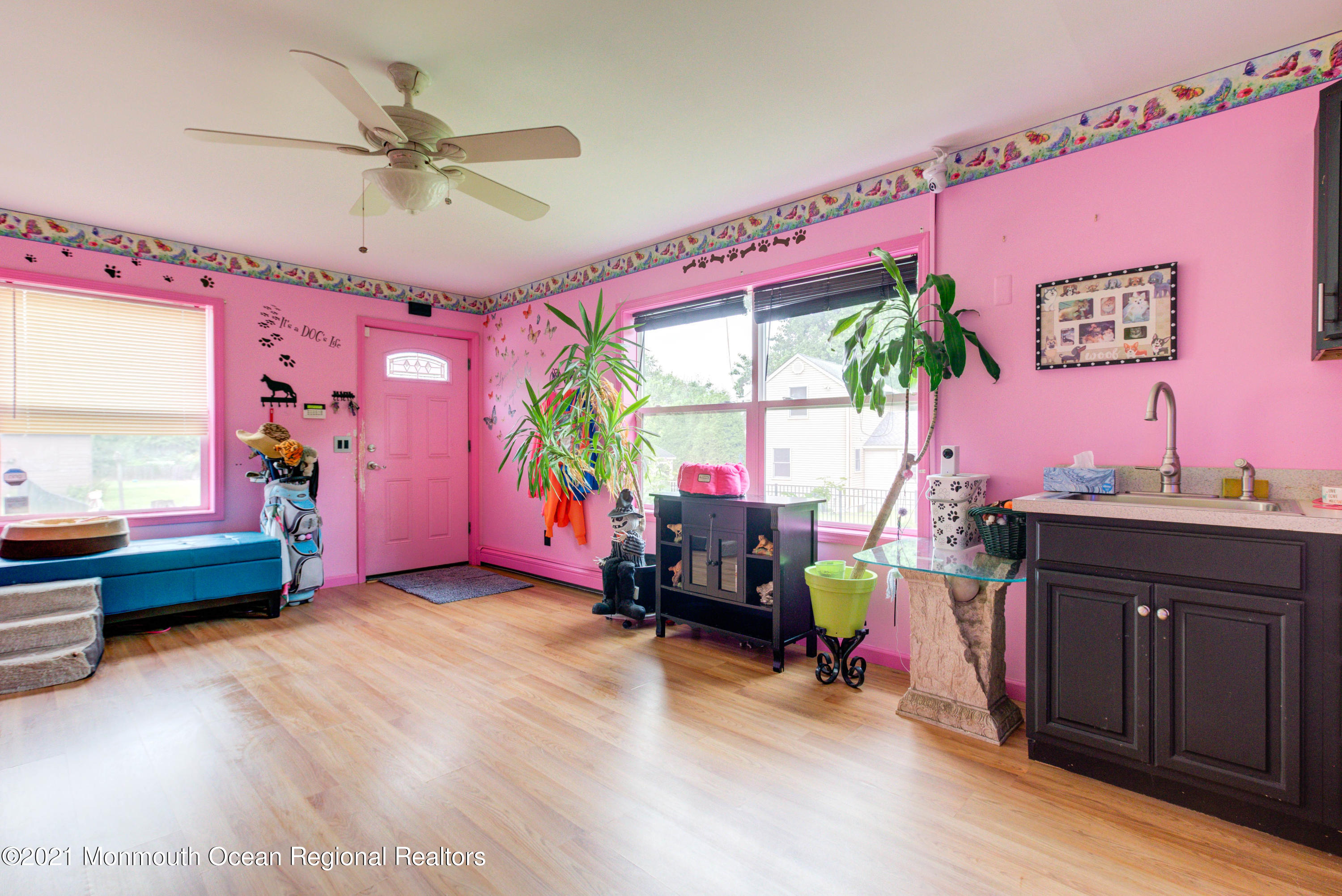 544 Brickyard Road Freehold, NJ 07728 - Photo 10 of 24 a living room with furniture a bed and a large window