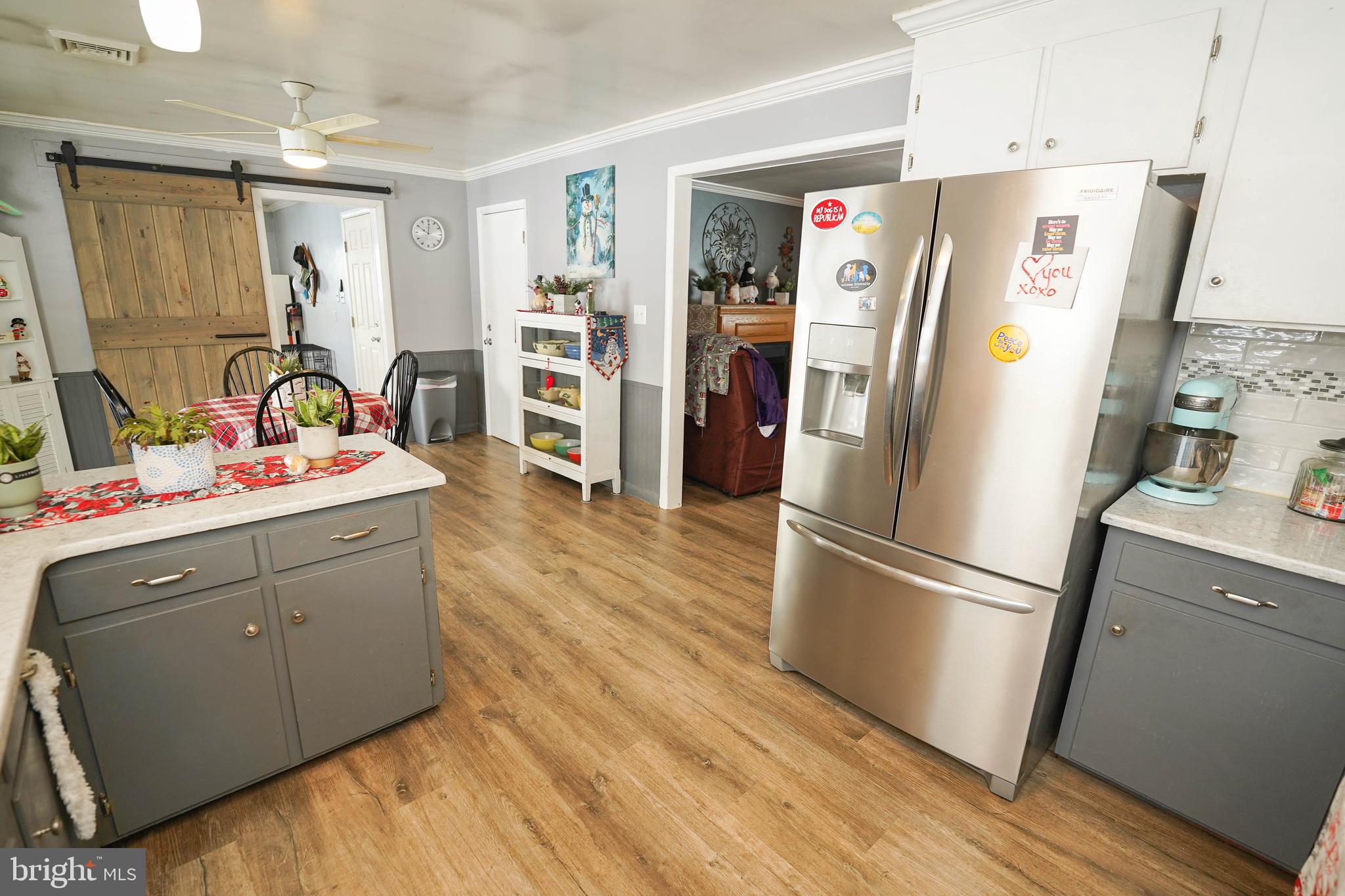 5627 Galestown Reliance Road Rhodesdale, MD 21659 - Photo 13 of 48 a kitchen with stainless steel appliances a refrigerator stove and wooden floor