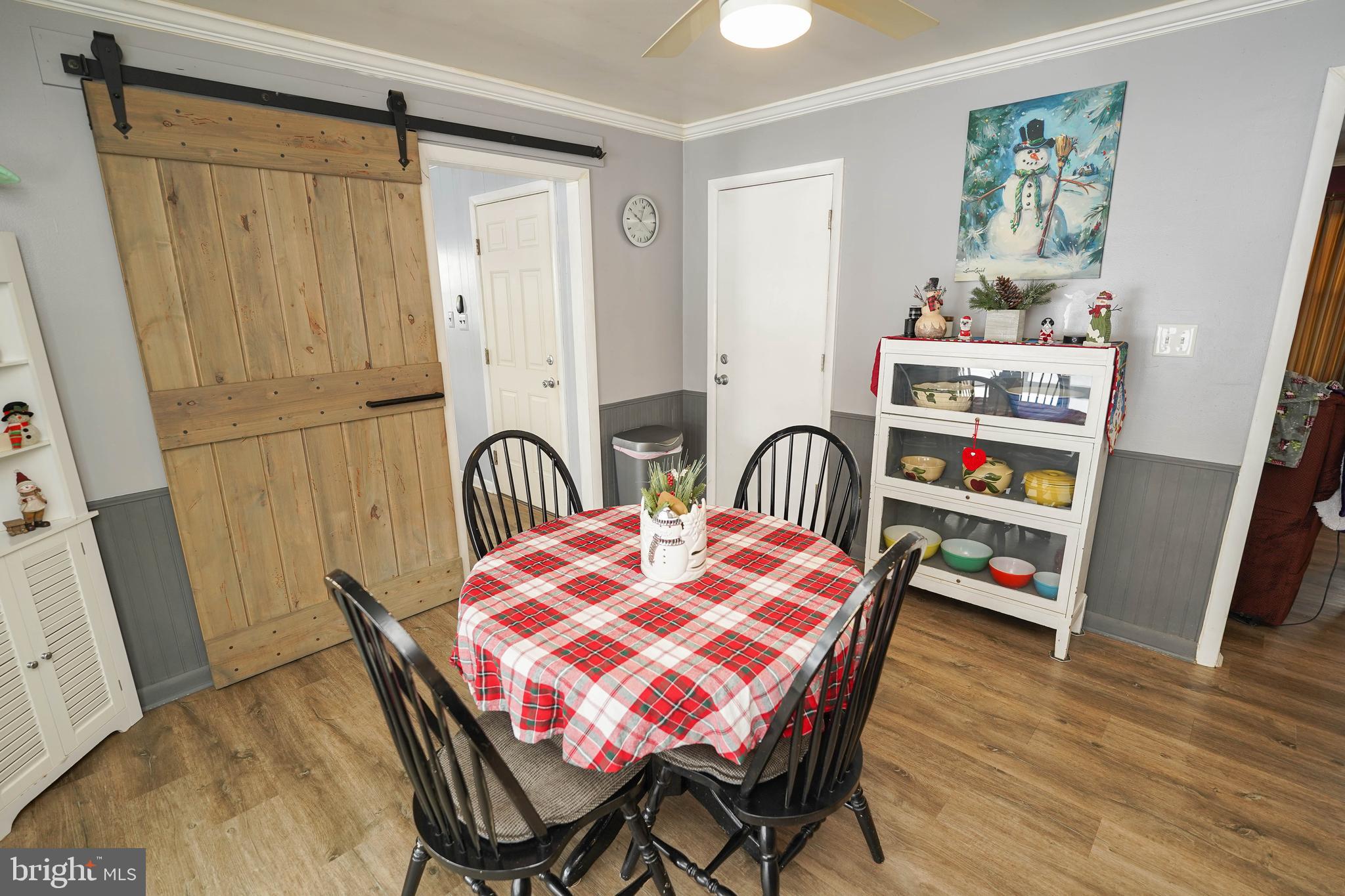 5627 Galestown Reliance Road Rhodesdale, MD 21659 - Photo 15 of 48 a dining room with furniture and wooden floor