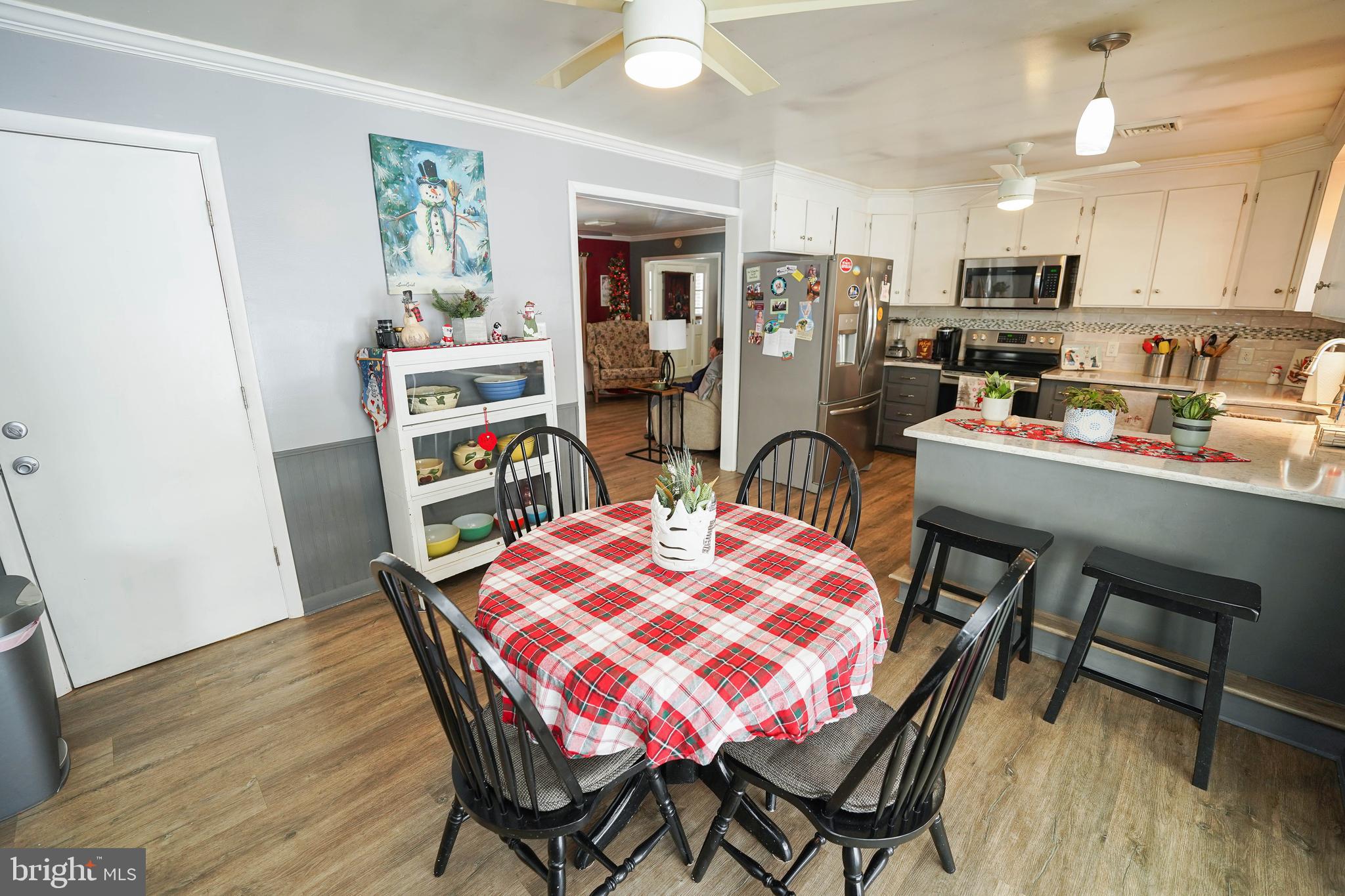 5627 Galestown Reliance Road Rhodesdale, MD 21659 - Photo 16 of 48 a dining room with furniture and wooden floor