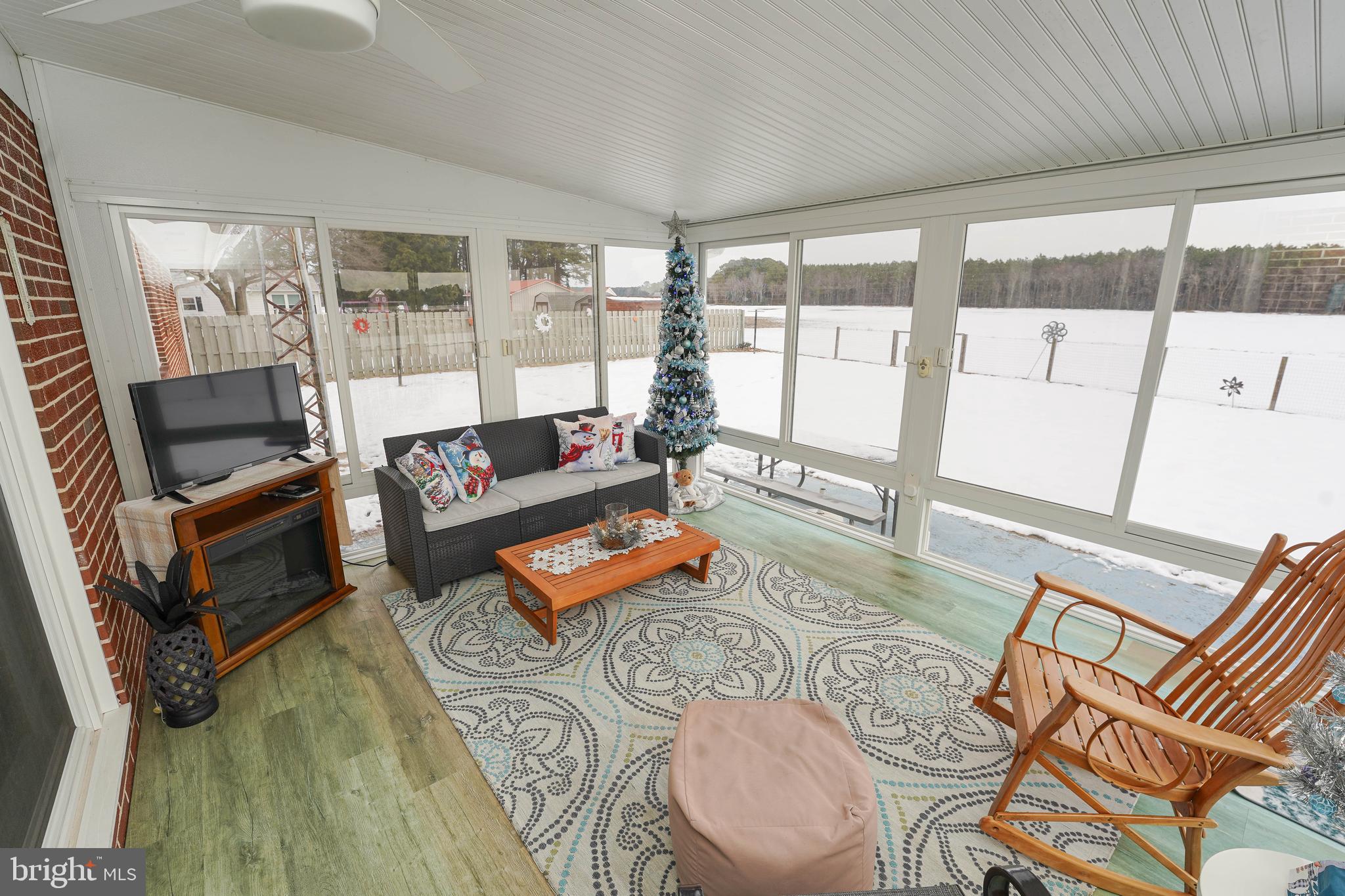 5627 Galestown Reliance Road Rhodesdale, MD 21659 - Photo 18 of 48 a living room with furniture and a floor to ceiling window
