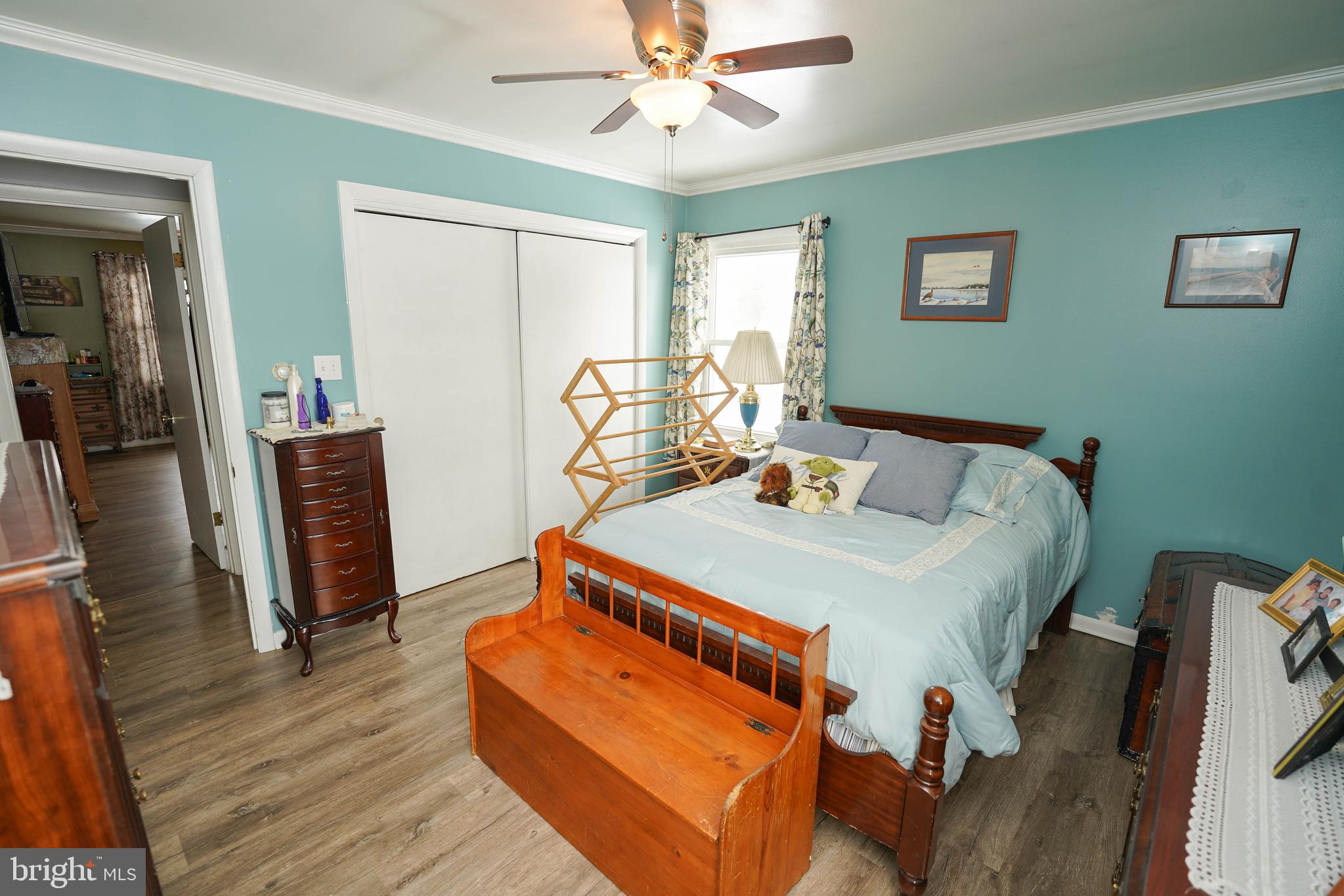 5627 Galestown Reliance Road Rhodesdale, MD 21659 - Photo 24 of 48 a bed sitting in a bedroom next to a window