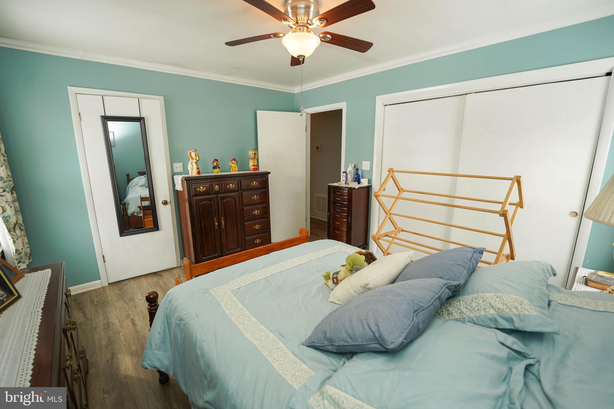 5627 Galestown Reliance Road Rhodesdale, MD 21659 - Photo 25 of 48 a bedroom with a bed and wooden floor