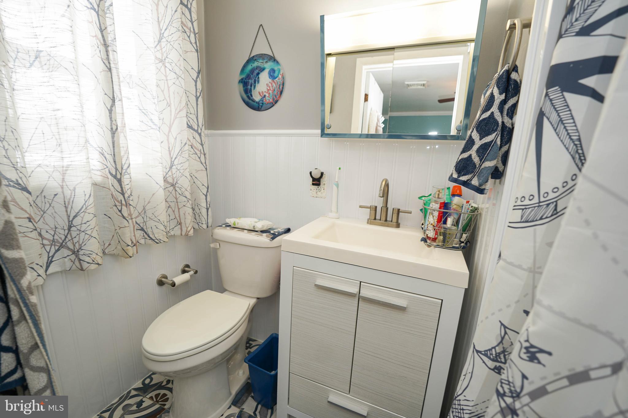 5627 Galestown Reliance Road Rhodesdale, MD 21659 - Photo 26 of 48 a bathroom with a toilet and a sink