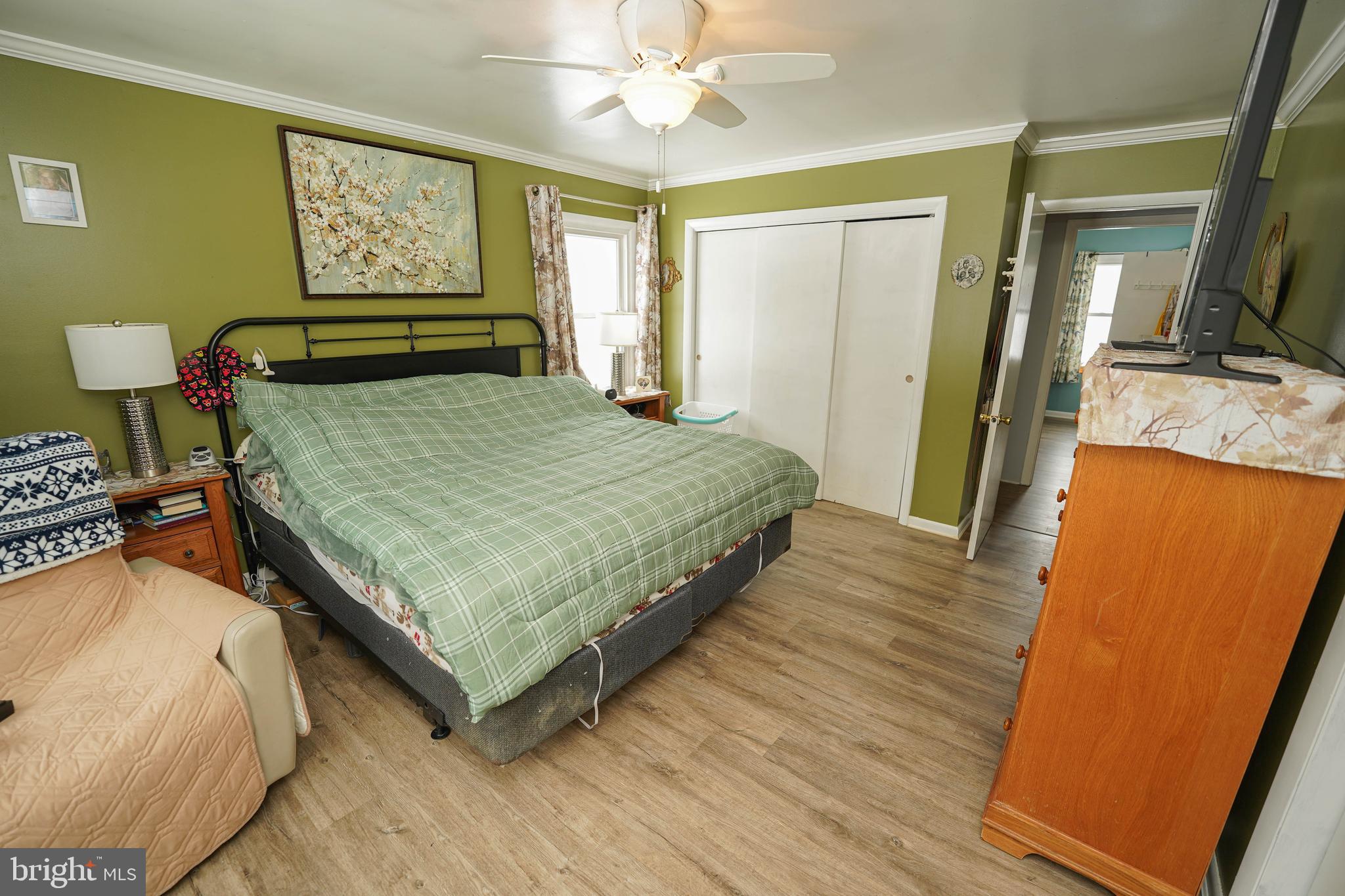 5627 Galestown Reliance Road Rhodesdale, MD 21659 - Photo 30 of 48 a bedroom with a bed and wooden floor