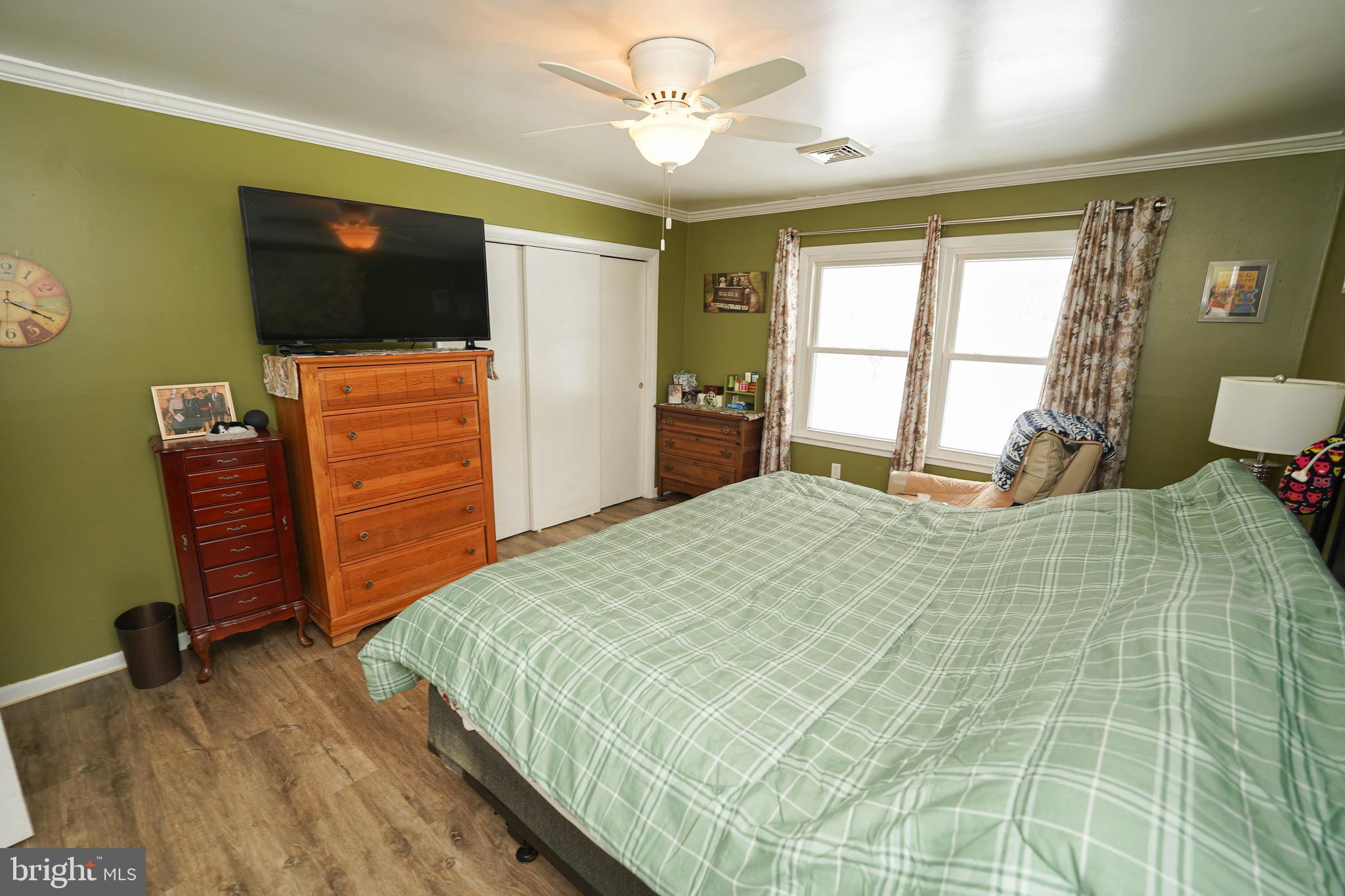 5627 Galestown Reliance Road Rhodesdale, MD 21659 - Photo 32 of 48 a bedroom with a bed and a television