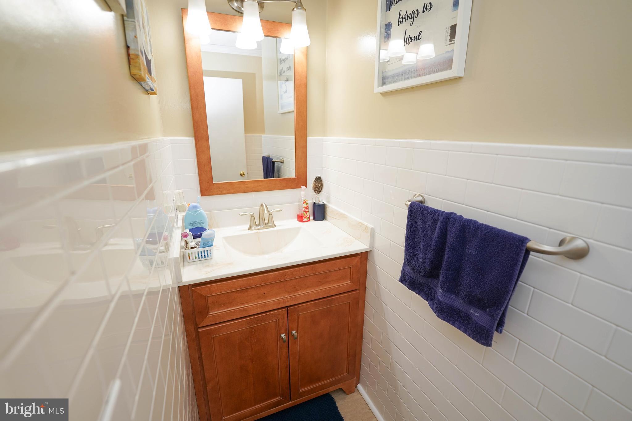 5627 Galestown Reliance Road Rhodesdale, MD 21659 - Photo 33 of 48 a bathroom with a sink vanity and mirror
