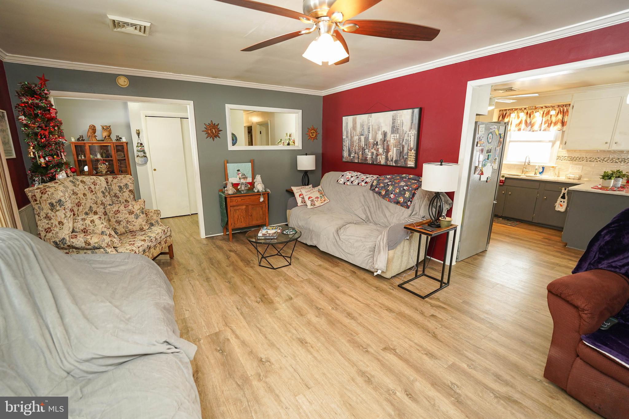 5627 Galestown Reliance Road Rhodesdale, MD 21659 - Photo 6 of 48 a living room with furniture and a wooden floor