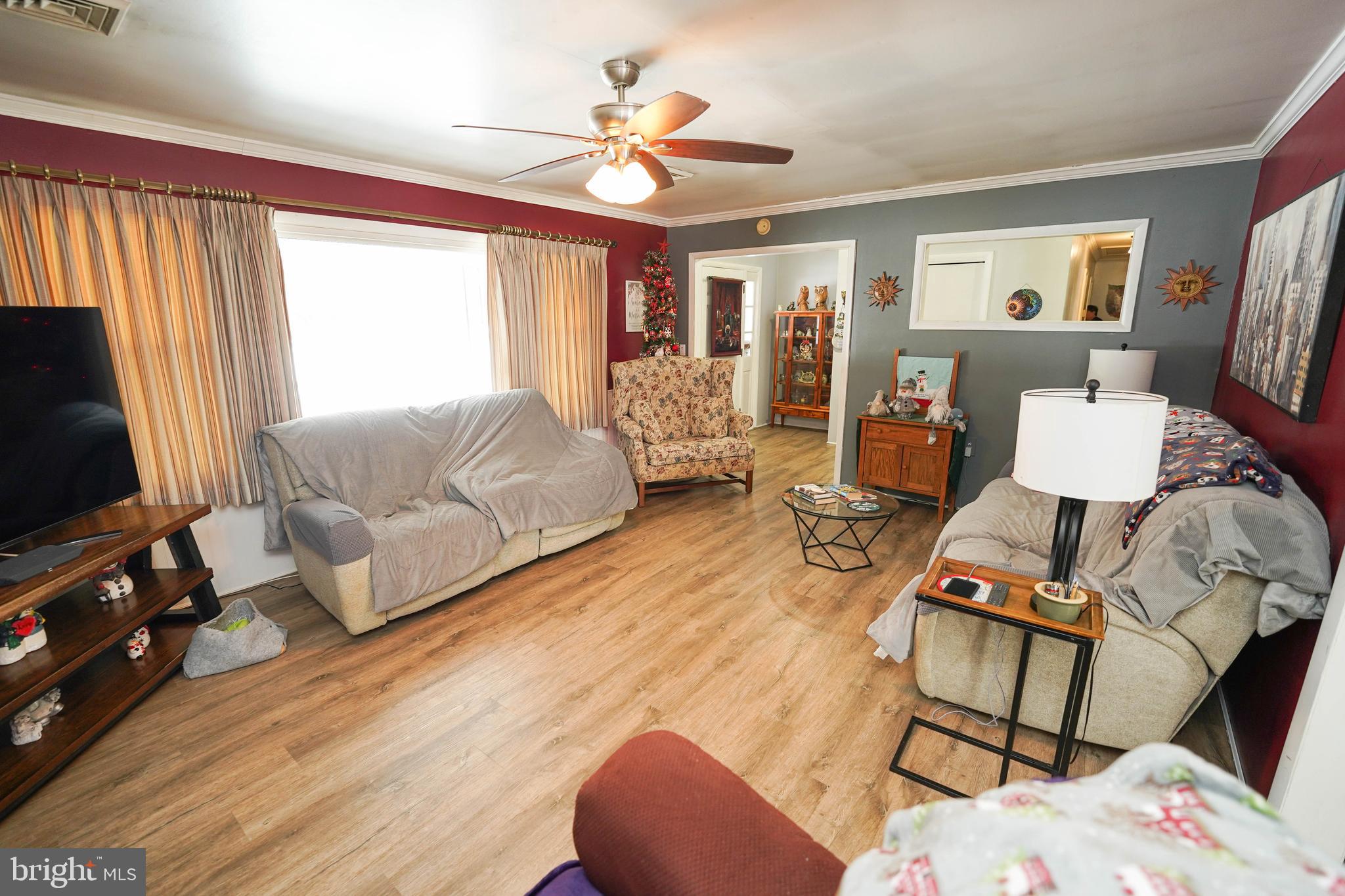 5627 Galestown Reliance Road Rhodesdale, MD 21659 - Photo 8 of 48 a living room with furniture and wooden floor