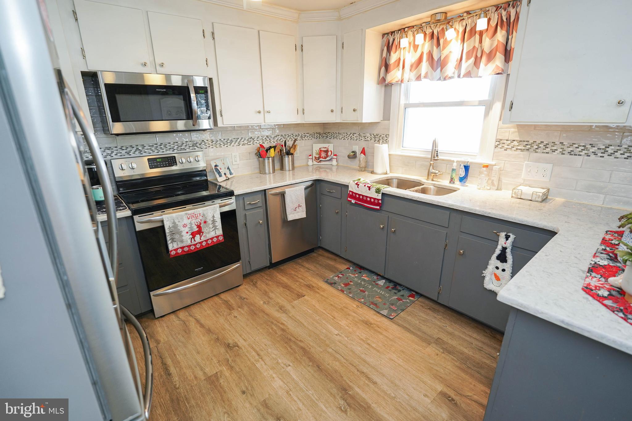 5627 Galestown Reliance Road Rhodesdale, MD 21659 - Photo 9 of 48 a kitchen with a sink cabinets and window