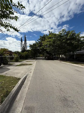 a view of an empty room and a window