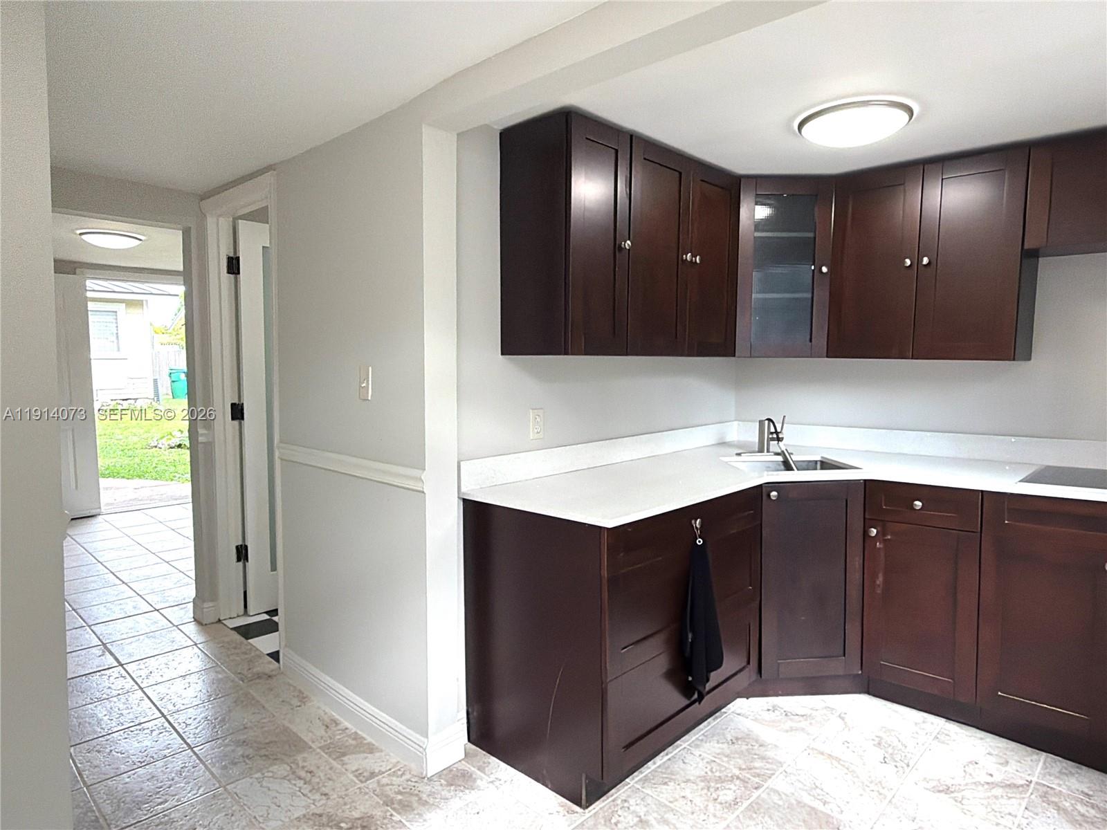 1350 Southwest 13th Street Miami, FL 33145 - Photo 2 of 5 a bathroom with a sink double vanity and a mirror