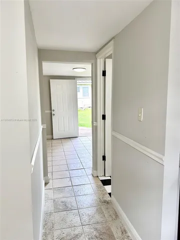 a bathroom with a sink double vanity and a mirror
