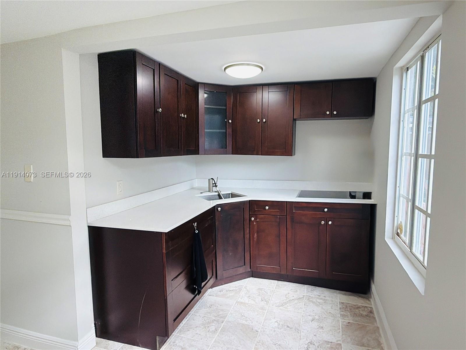 1350 Southwest 13th Street Miami, FL 33145 - Photo 3 of 5 a bathroom with a sink vanity and mirror