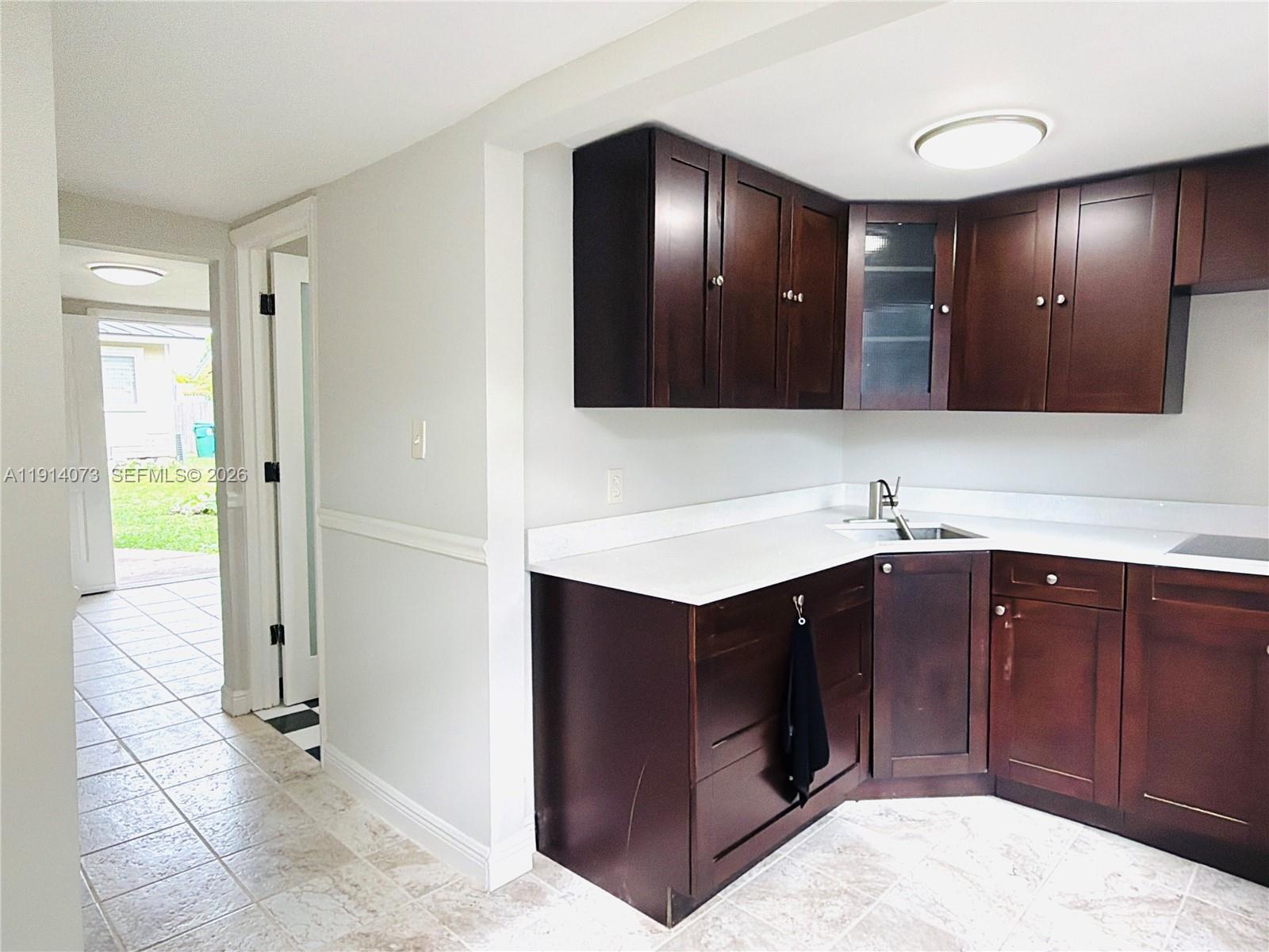 1350 Southwest 13th Street Miami, FL 33145 - Photo 4 of 5 a bathroom with a sink double vanity and a mirror