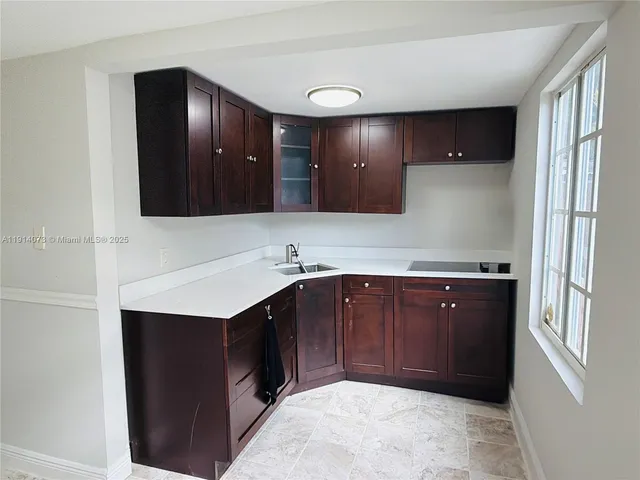 a bathroom with a sink double vanity and a mirror