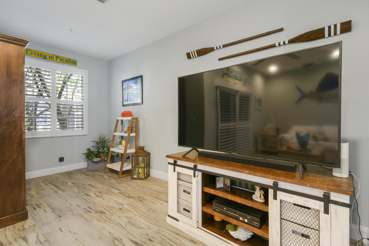 105 Lighthouse Circle, Unit D Tequesta, FL 33469 - Photo 14 of 36 a room with furniture and window