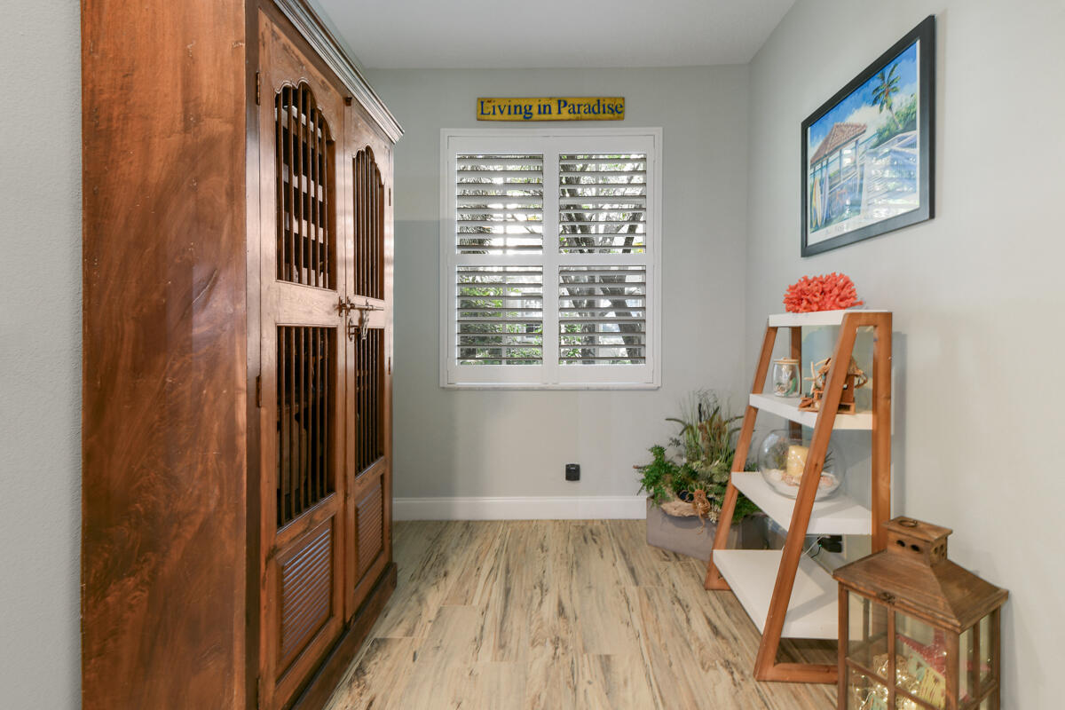 105 Lighthouse Circle, Unit D Tequesta, FL 33469 - Photo 15 of 36 a view of an entryway with wooden floor