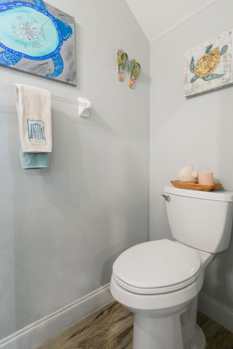 105 Lighthouse Circle, Unit D Tequesta, FL 33469 - Photo 18 of 36 a white toilet sitting next to a white wall