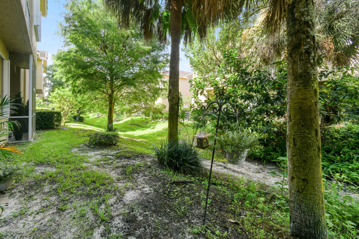 105 Lighthouse Circle, Unit D Tequesta, FL 33469 - Photo 21 of 36 a view of a garden