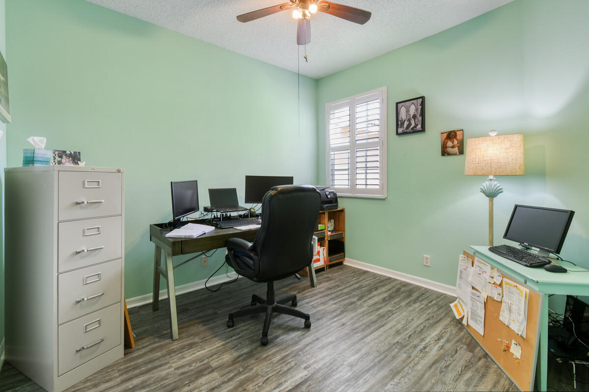 105 Lighthouse Circle, Unit D Tequesta, FL 33469 - Photo 34 of 36 a view of a workspace with furniture and a window