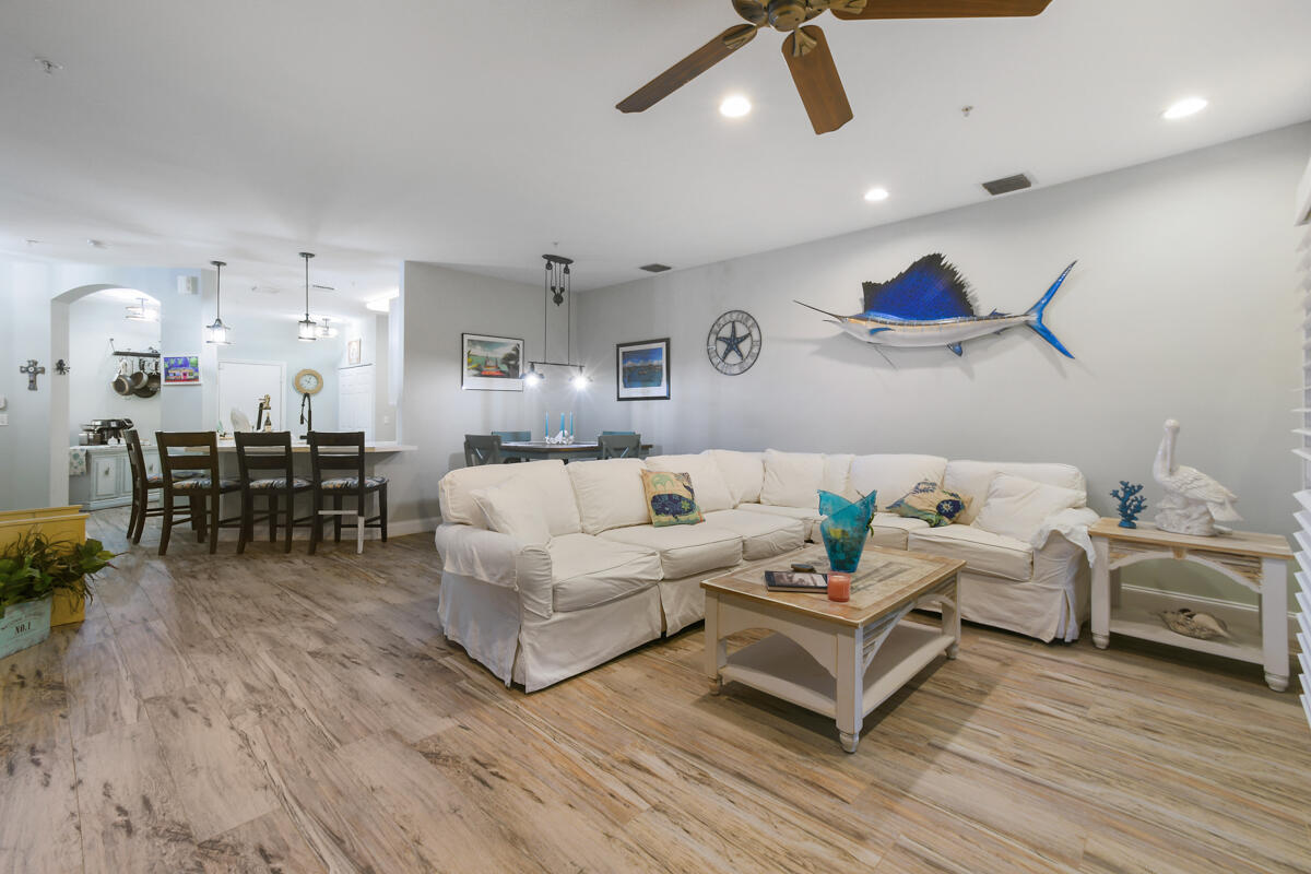 105 Lighthouse Circle, Unit D Tequesta, FL 33469 - Photo 10 of 36 a living room with furniture and wooden floor