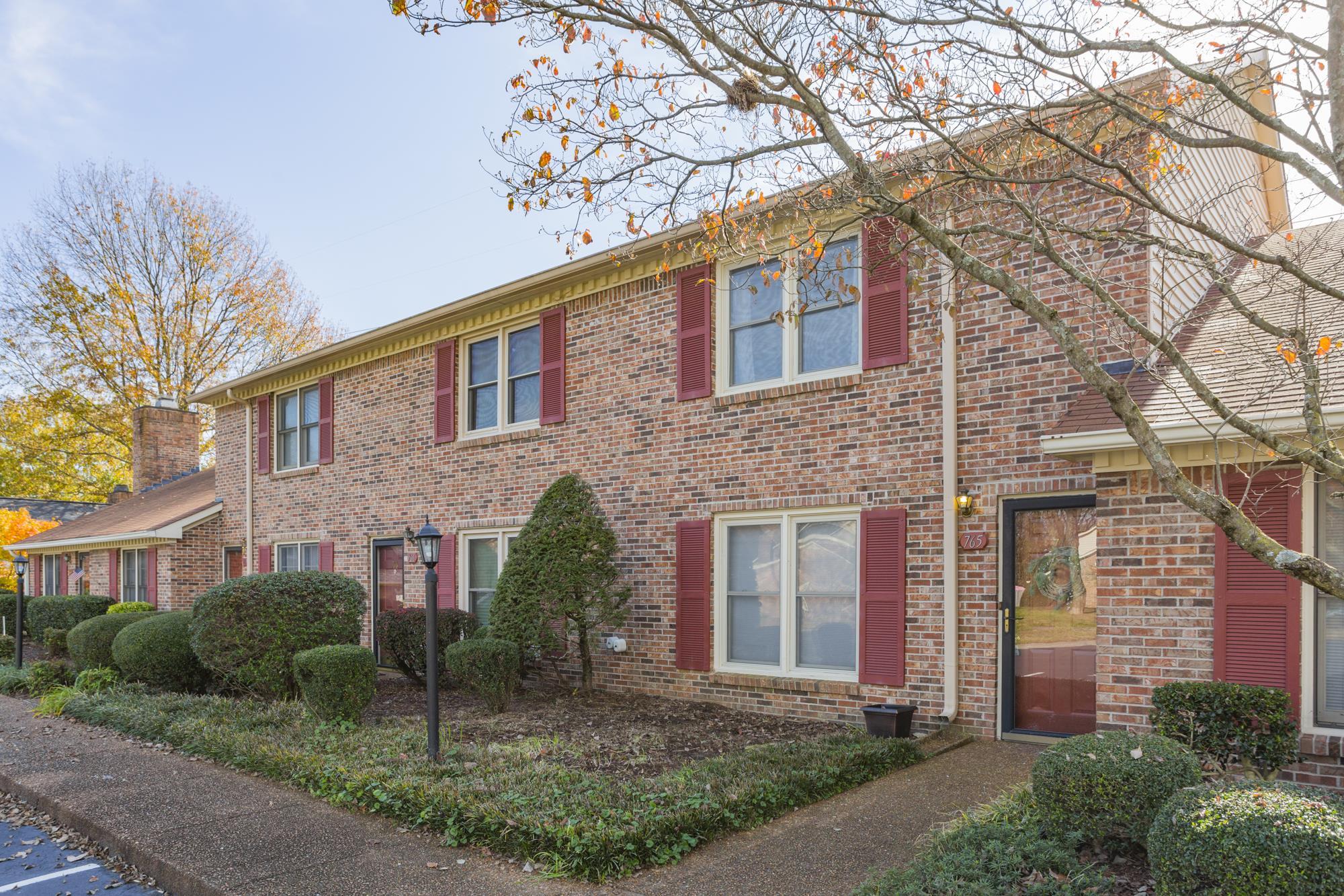 765 Kent Road, Unit 765 Nashville, TN 37214 - Photo 1 of 30 a front view of a house with garden