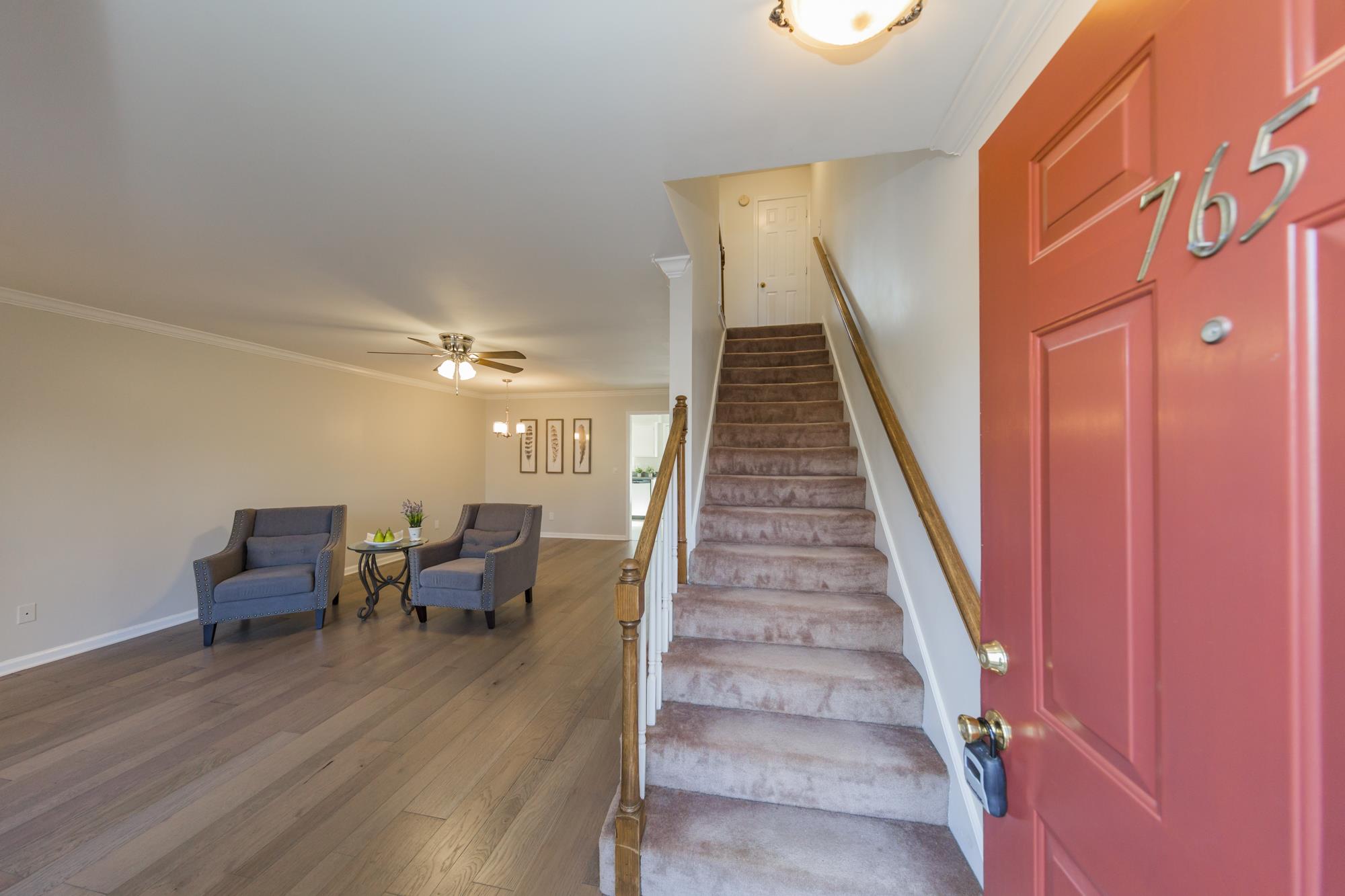 765 Kent Road, Unit 765 Nashville, TN 37214 - Photo 2 of 30 a living room with furniture and stairs
