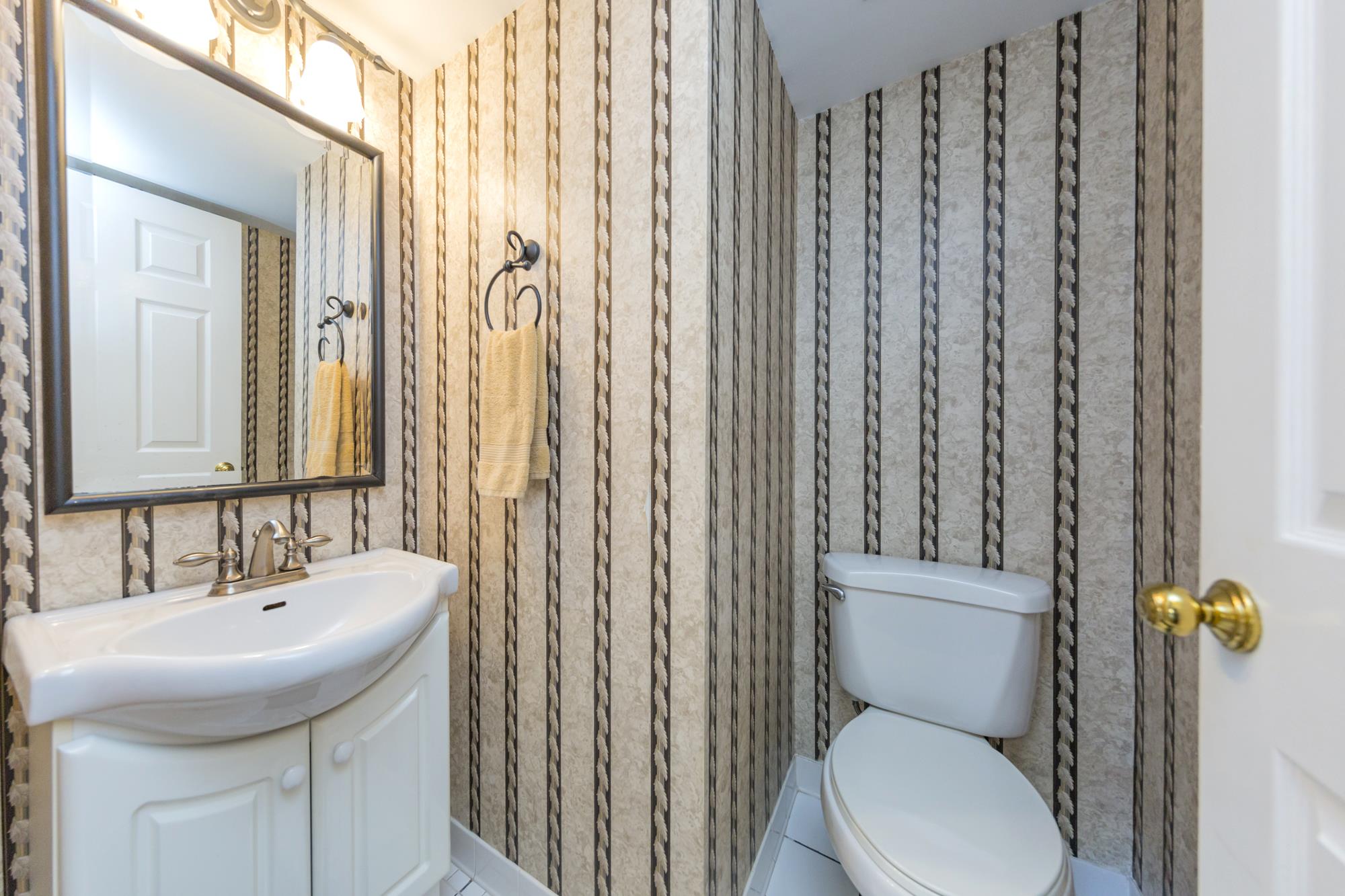 765 Kent Road, Unit 765 Nashville, TN 37214 - Photo 15 of 30 a bathroom with a sink a toilet and shower curtain