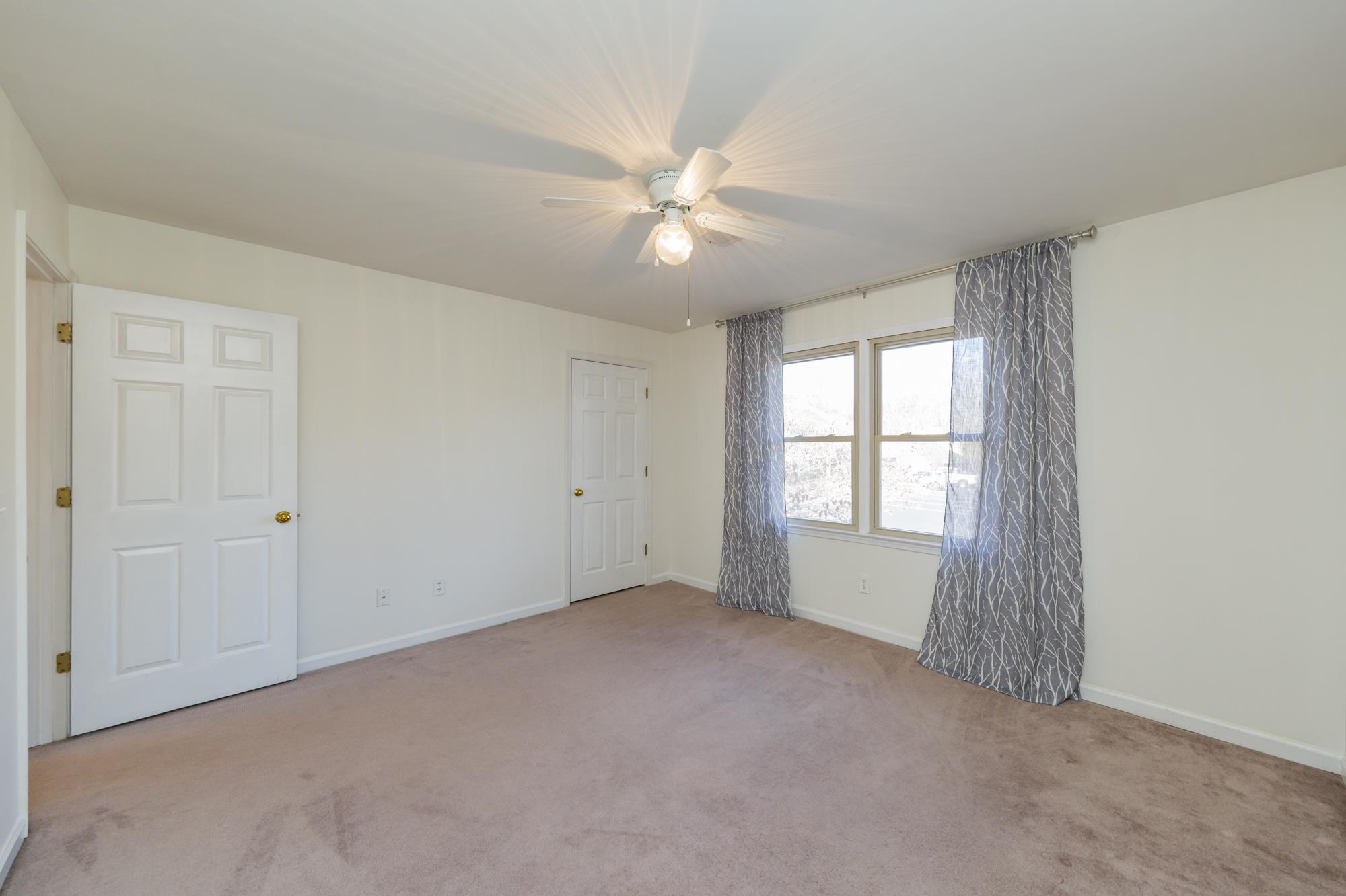 765 Kent Road, Unit 765 Nashville, TN 37214 - Photo 18 of 30 a view of a livingroom with a ceiling fan and window