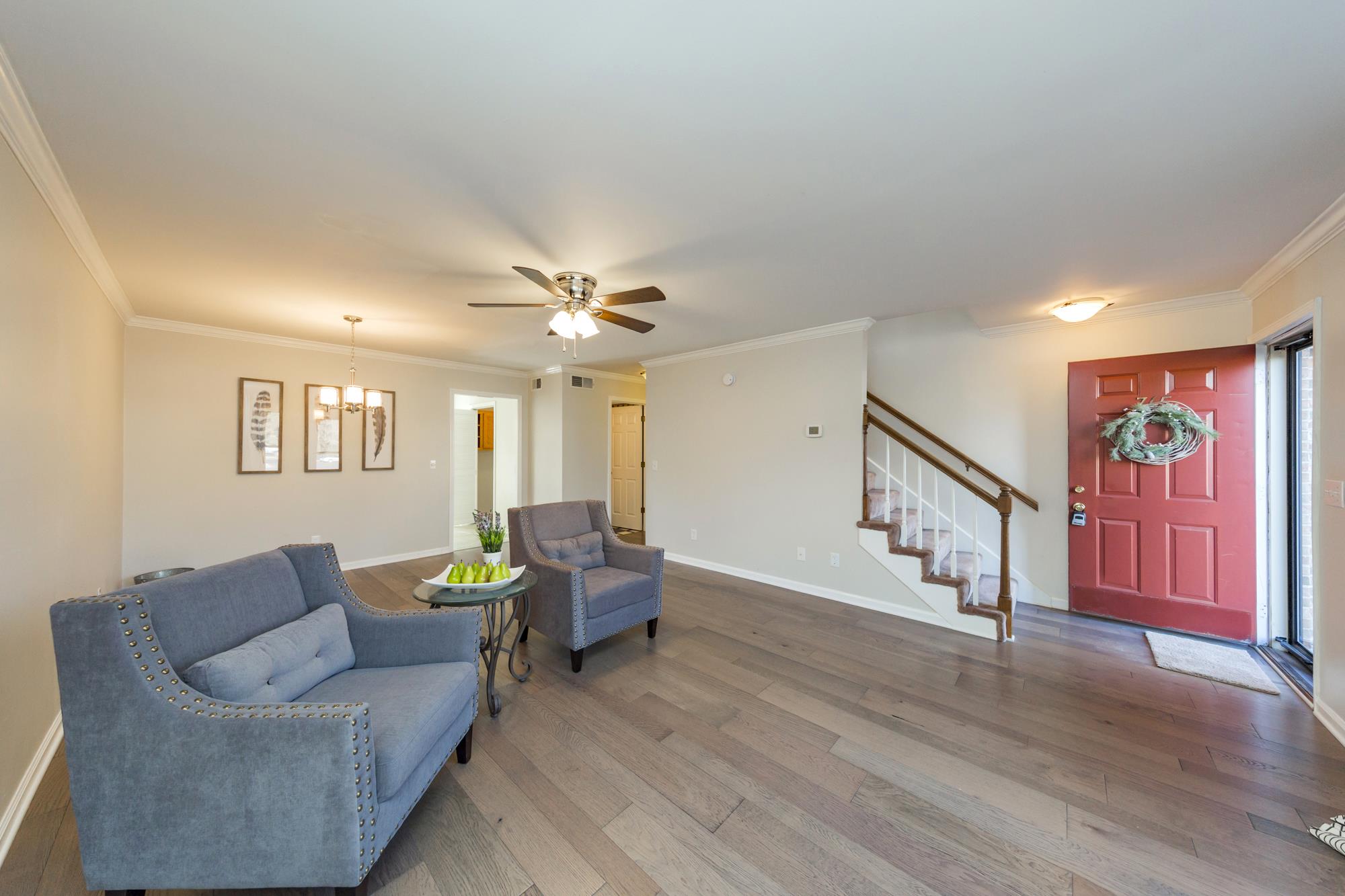 765 Kent Road, Unit 765 Nashville, TN 37214 - Photo 5 of 30 a living room with furniture and a wooden floor