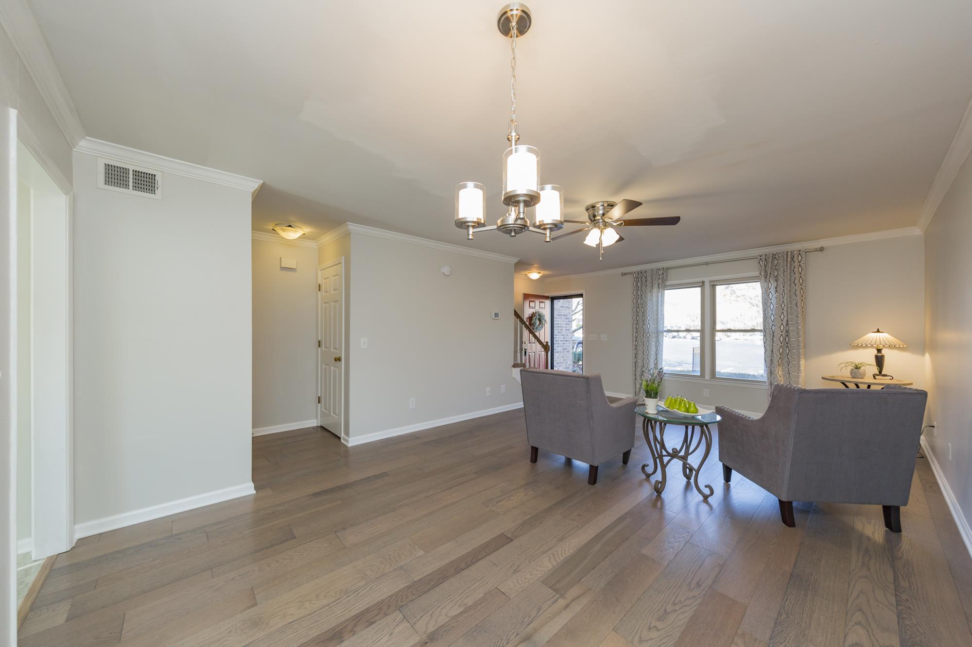 765 Kent Road, Unit 765 Nashville, TN 37214 - Photo 7 of 30 a view of a dining room with furniture and wooden floor