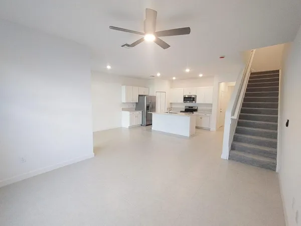 a view of entryway and kitchen