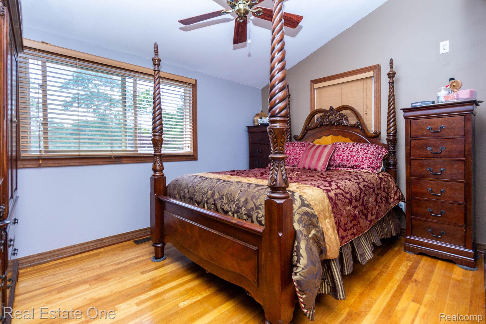 220 Winry Drive Rochester, MI 48307 - Photo 16 of 35 Hardwood flooring throughout, complemented by a ceiling fan with integrated lighting
